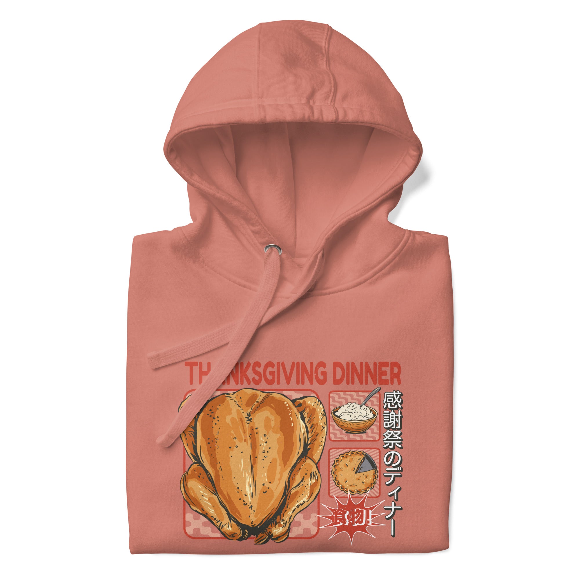 Folded Japanese Thanksgiving Hoodie in Dusty Rose color: A soft, muted pinkish-red hoodie with a graphic print of a Japanese Thanksgiving, featuring a roast chicken, Japanese potato salad, and an apple pie. The hoodie is neatly folded.
