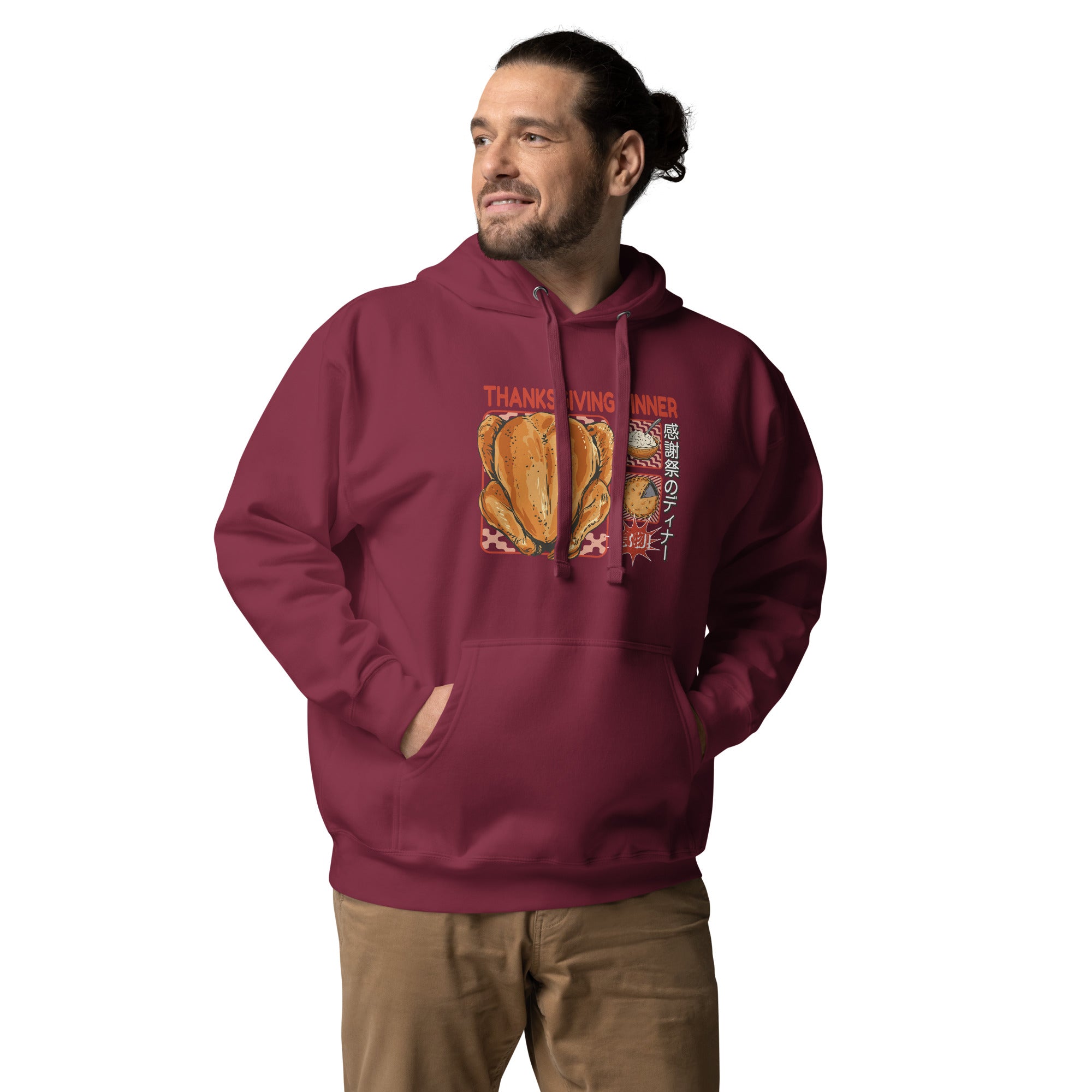 Man wearing a Japanese Thanksgiving hoodie in Maroon colorway, featuring a graphic print of a roast chicken, Japanese potato salad, and an apple pie.