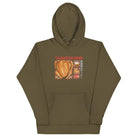 Front of Japanese Thanksgiving Hoodie in Military Green: The front of an earthy military green hoodie featuring a detailed Japanese Thanksgiving graphic, including a roast chicken, Japanese potato salad, and an apple pie.