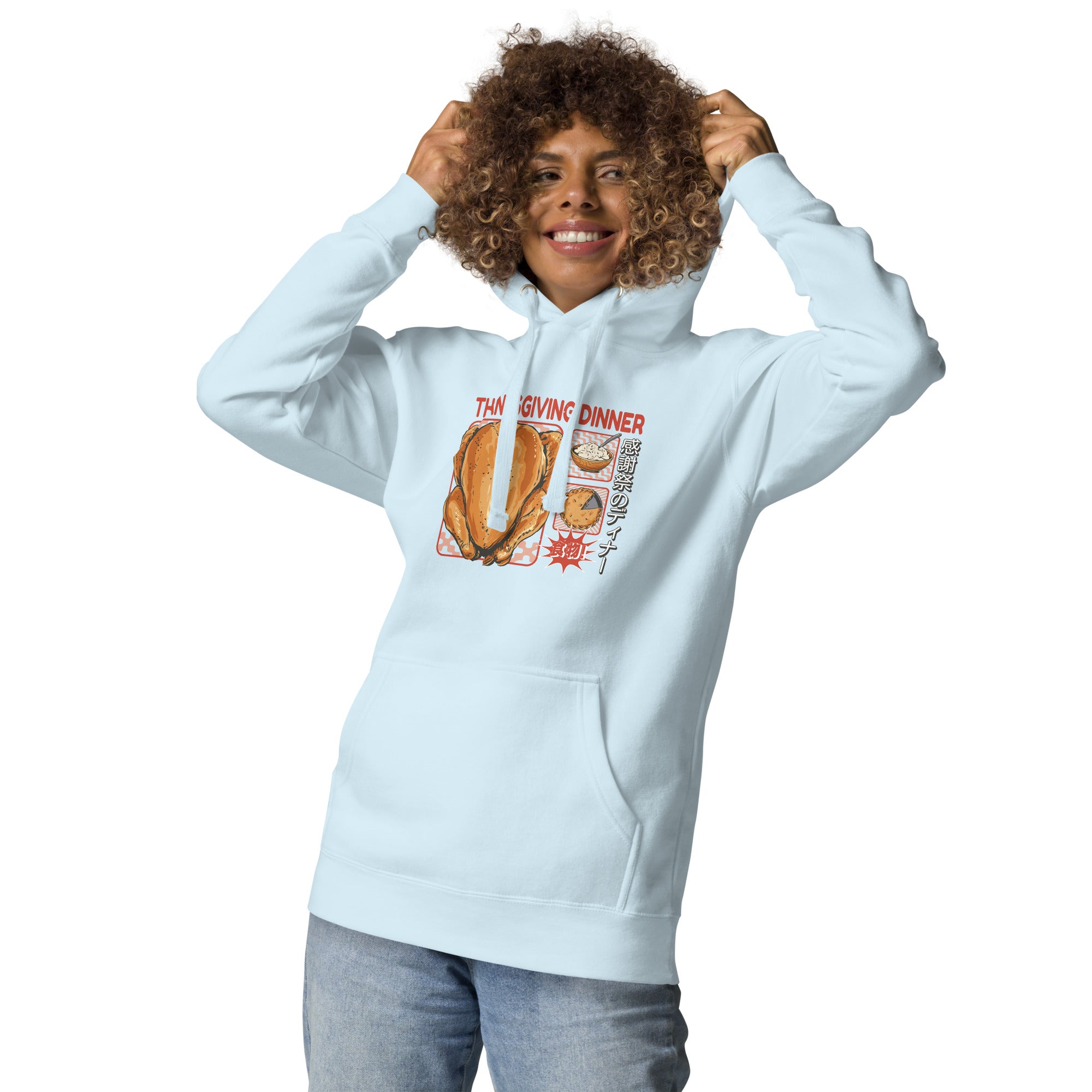 Woman wearing a Japanese Thanksgiving hoodie in Sky Blue colorway featuring a graphic print of roast chicken, Japanese potato salad, and an apple pie.