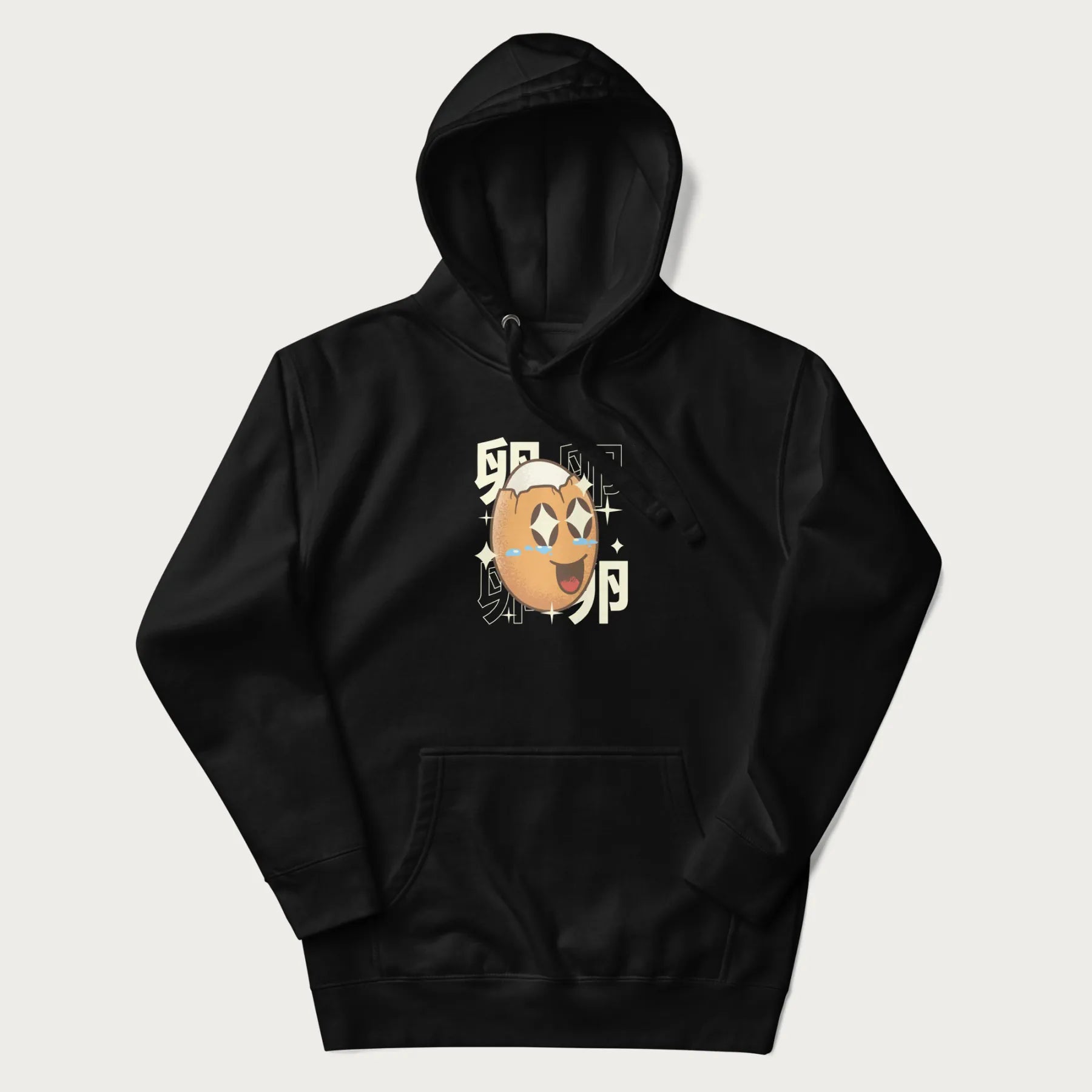 Black hoodie with Japanese graphic of a smiling egg with tears of joy, surrounded by the Japanese text '卵' (Egg).