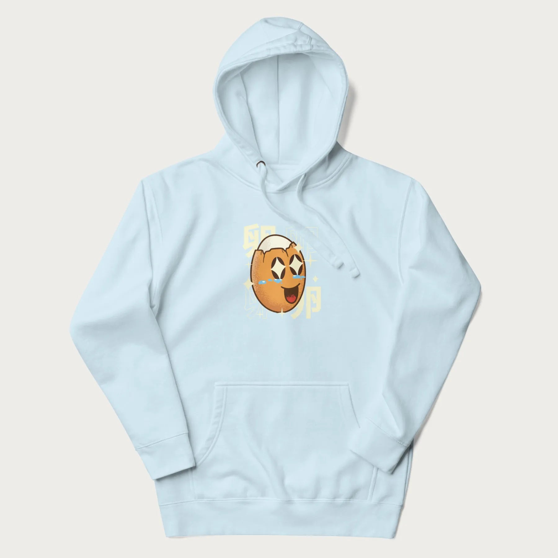 Light blue hoodie with Japanese graphic of a smiling egg with tears of joy, surrounded by the Japanese text '卵' (Egg).