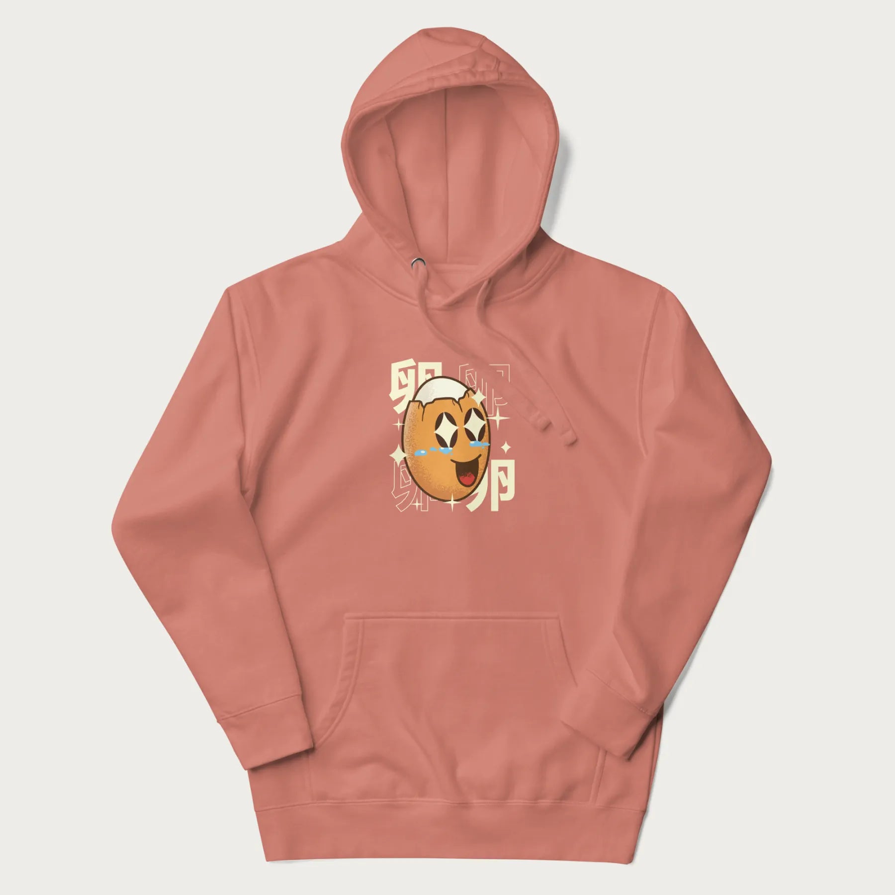 Light pink hoodie with Japanese graphic of a smiling egg with tears of joy, surrounded by the Japanese text '卵' (Egg).