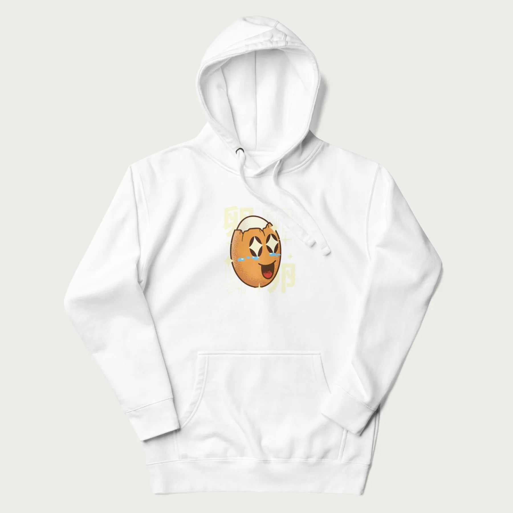 White hoodie with Japanese graphic of a smiling egg with tears of joy, surrounded by the Japanese text '卵' (Egg).