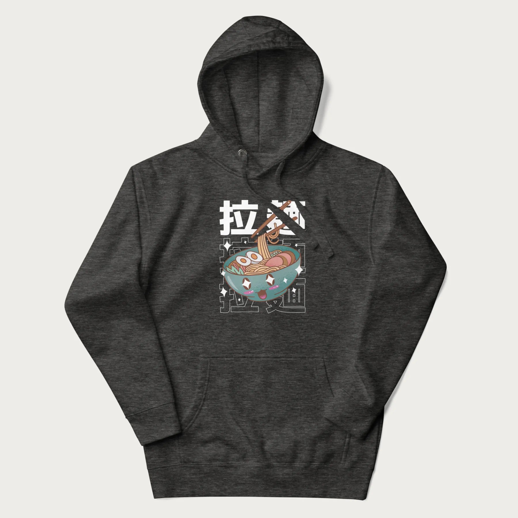 Dark grey hoodie with Japanese text '拉麵' (Ramen) and graphic of a kawaii ramen bowl with sparkling eyes and blushed cheeks.