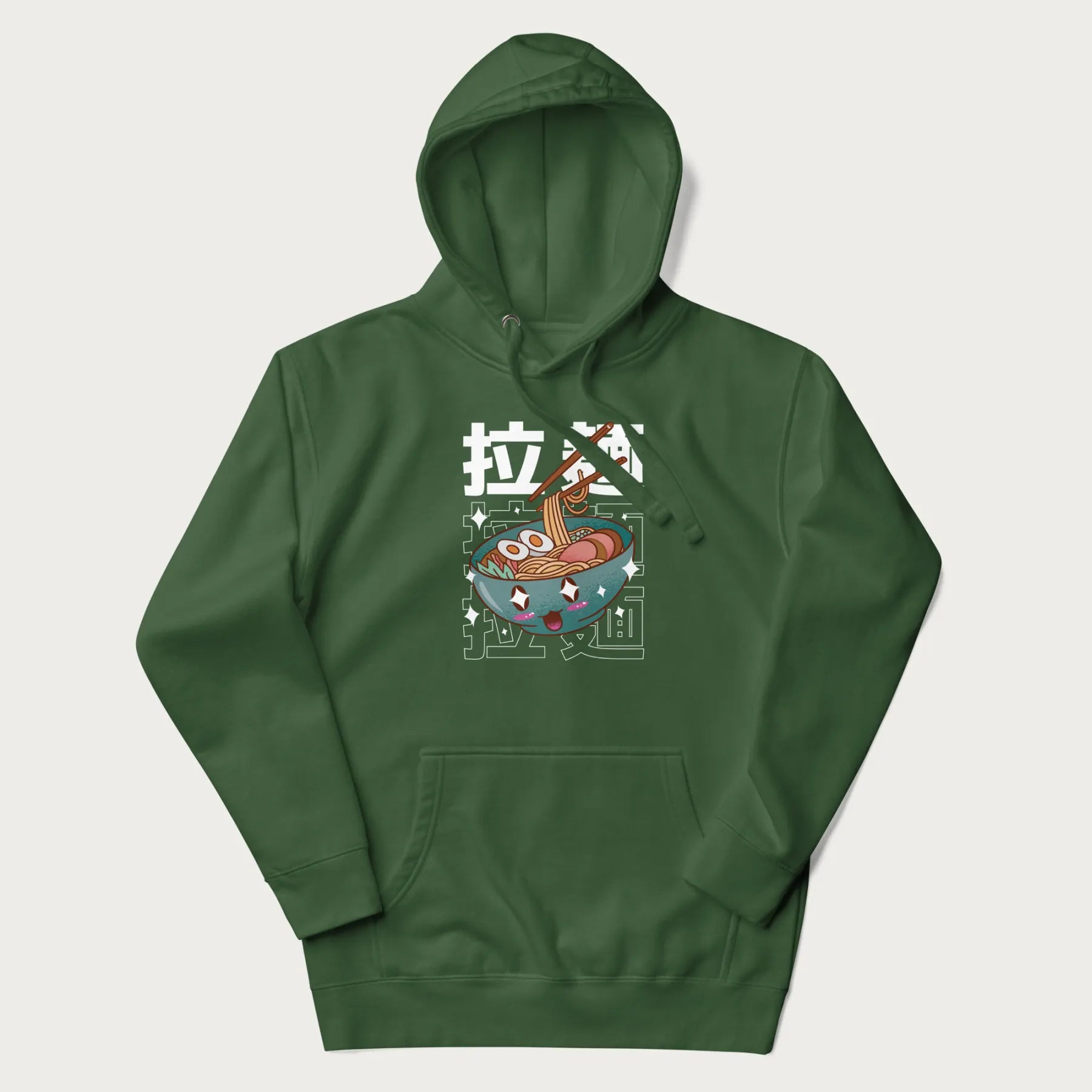 Forest green hoodie with Japanese text '拉麵' (Ramen) and graphic of a kawaii ramen bowl with sparkling eyes and blushed cheeks.