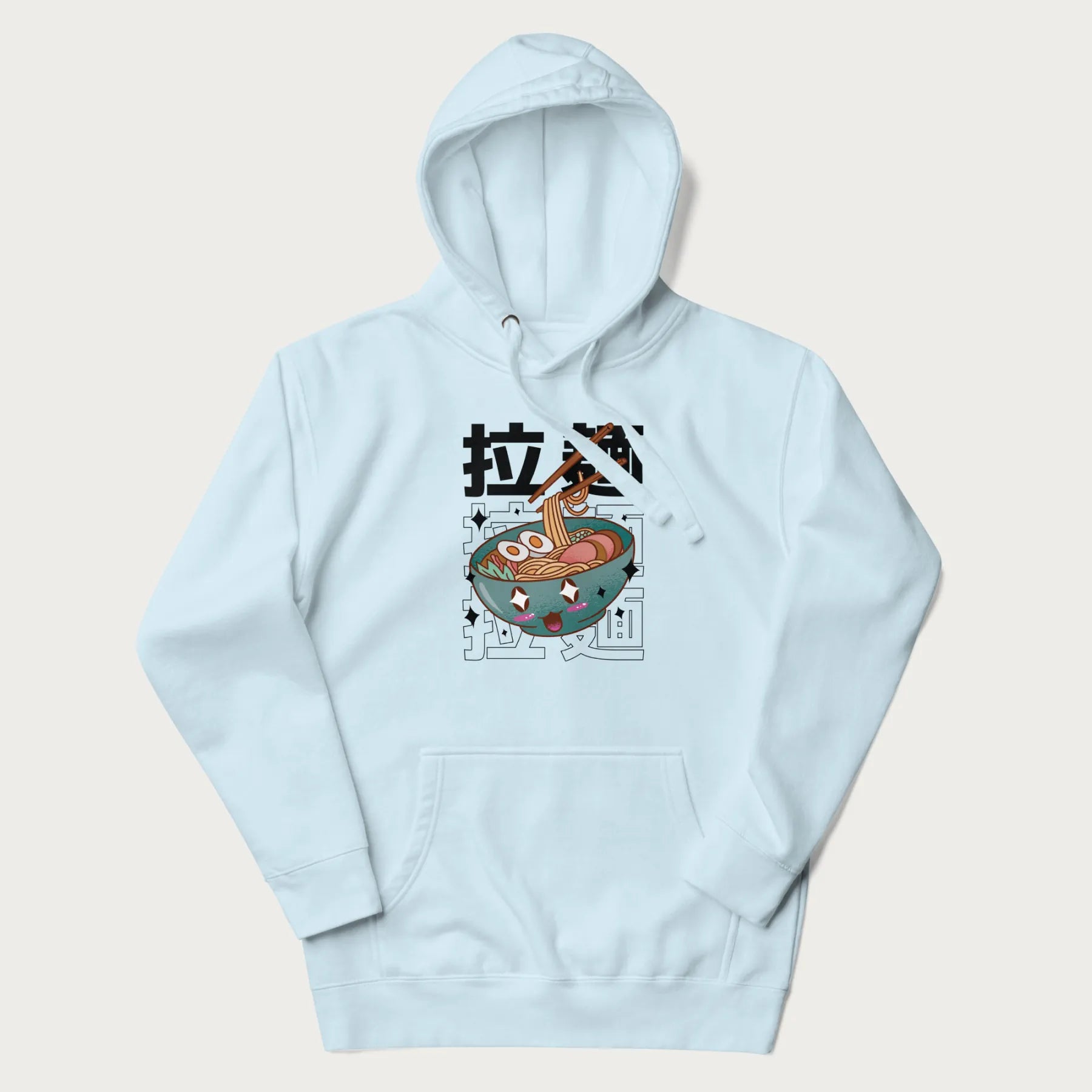 Light blue hoodie with Japanese text '拉麵' (Ramen) and graphic of a kawaii ramen bowl with sparkling eyes and blushed cheeks.