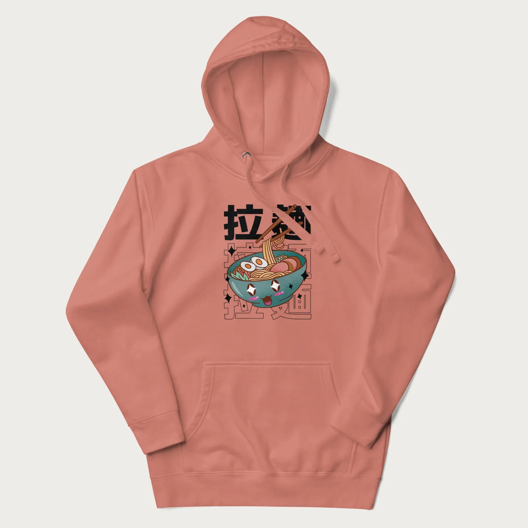 Light pink hoodie with Japanese text '拉麵' (Ramen) and graphic of a kawaii ramen bowl with sparkling eyes and blushed cheeks.