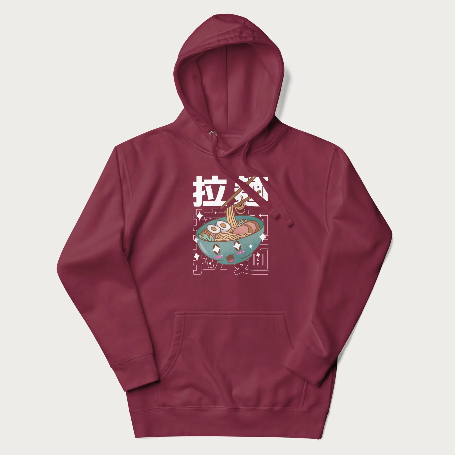 Maroon hoodie with Japanese text '拉麵' (Ramen) and graphic of a kawaii ramen bowl with sparkling eyes and blushed cheeks.