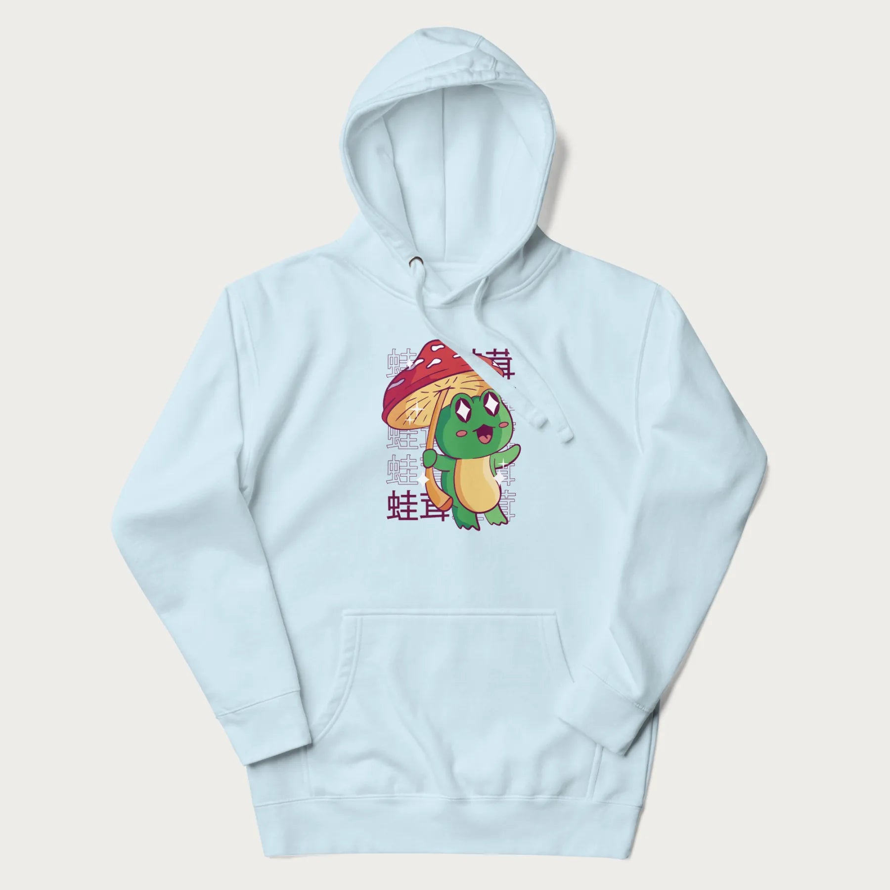 Light blue hoodie with Japanese graphic of a cute green frog holding a red mushroom and Japanese text '蛙茸' in the background.