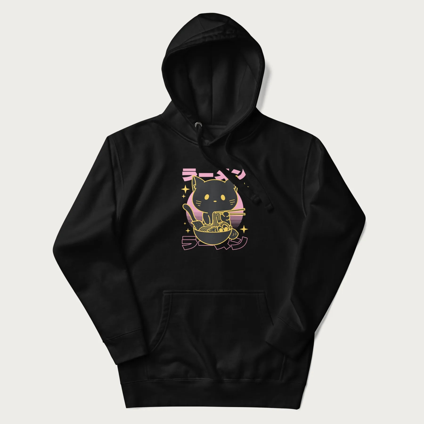Black hoodie with Japanese text 'ラーメン' (ramen) and a retro design of a cute black cat eating ramen.