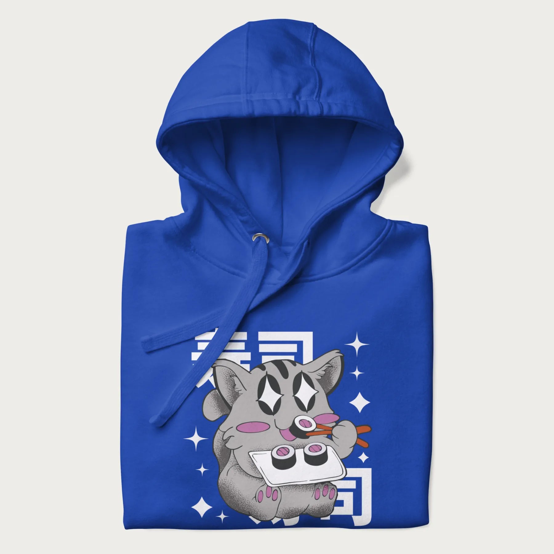 Folded royal blue hoodie with Japanese graphic of a cute grey cat eating sushi, with the Japanese text '寿司' (Sushi) in the background.