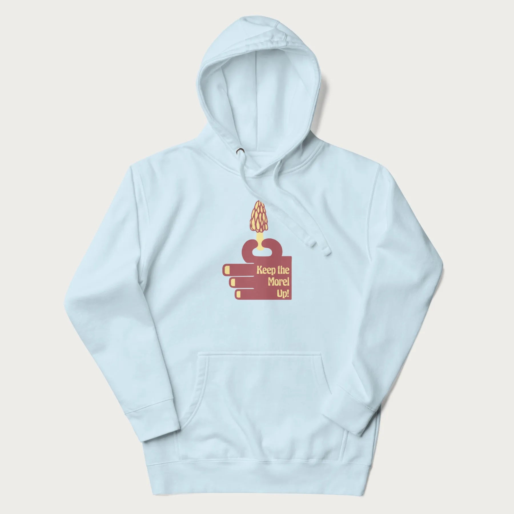 Light blue hoodie with a simple graphic of a hand holding a morel mushroom and the phrase 'Keep the Morel Up!'
