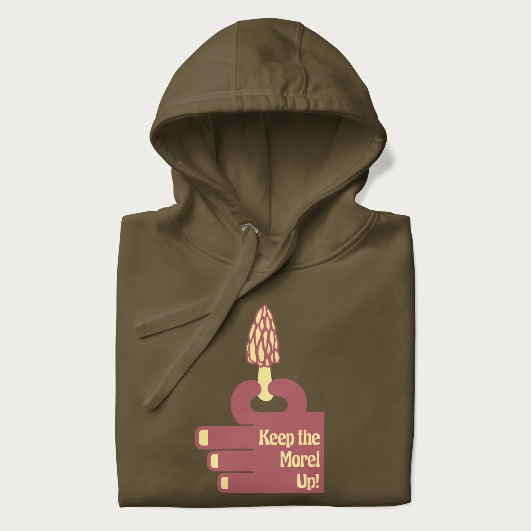 Folded military green hoodie with a simple graphic of a hand holding a morel mushroom and the phrase 'Keep the Morel Up!'