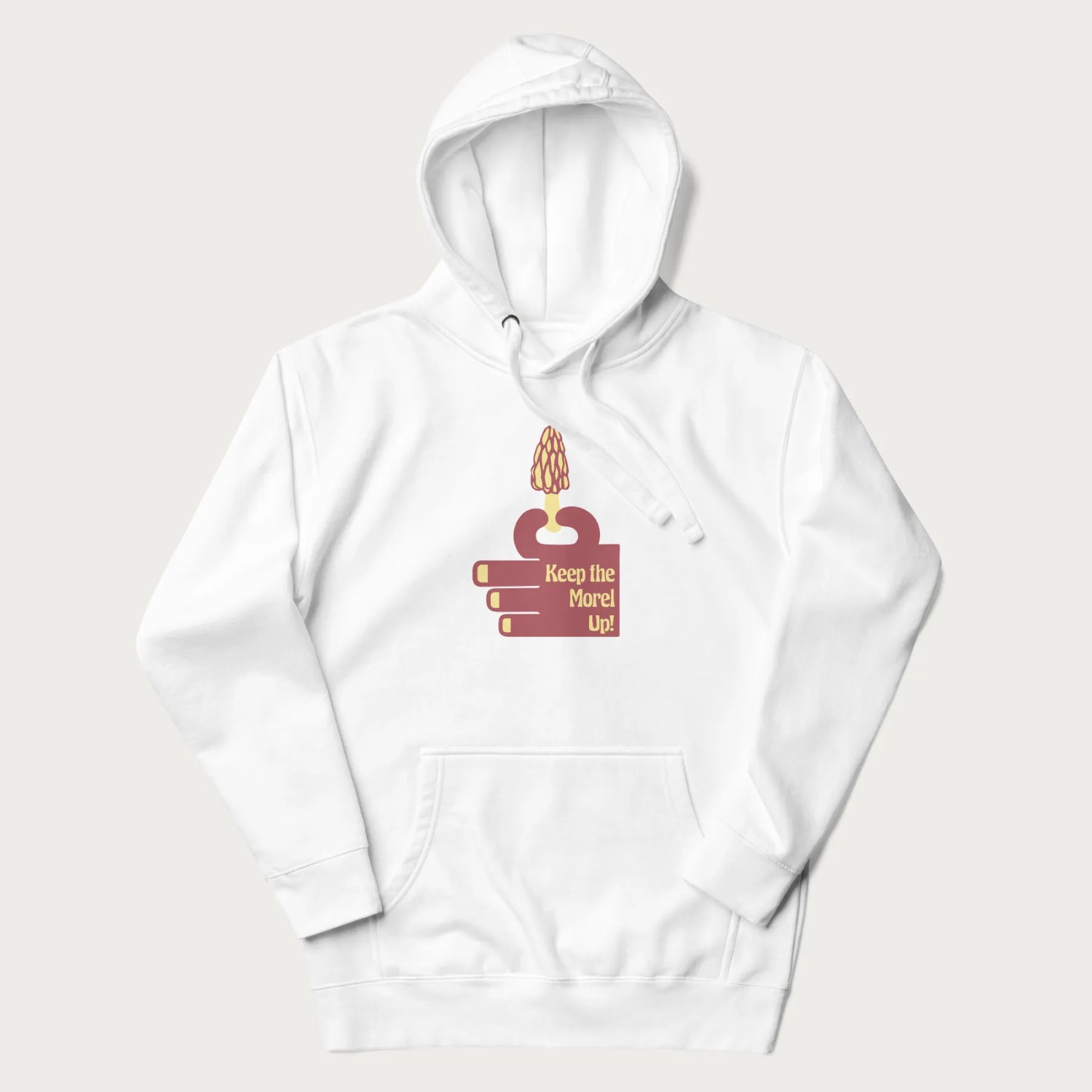 White hoodie with a simple graphic of a hand holding a morel mushroom and the phrase 'Keep the Morel Up!'