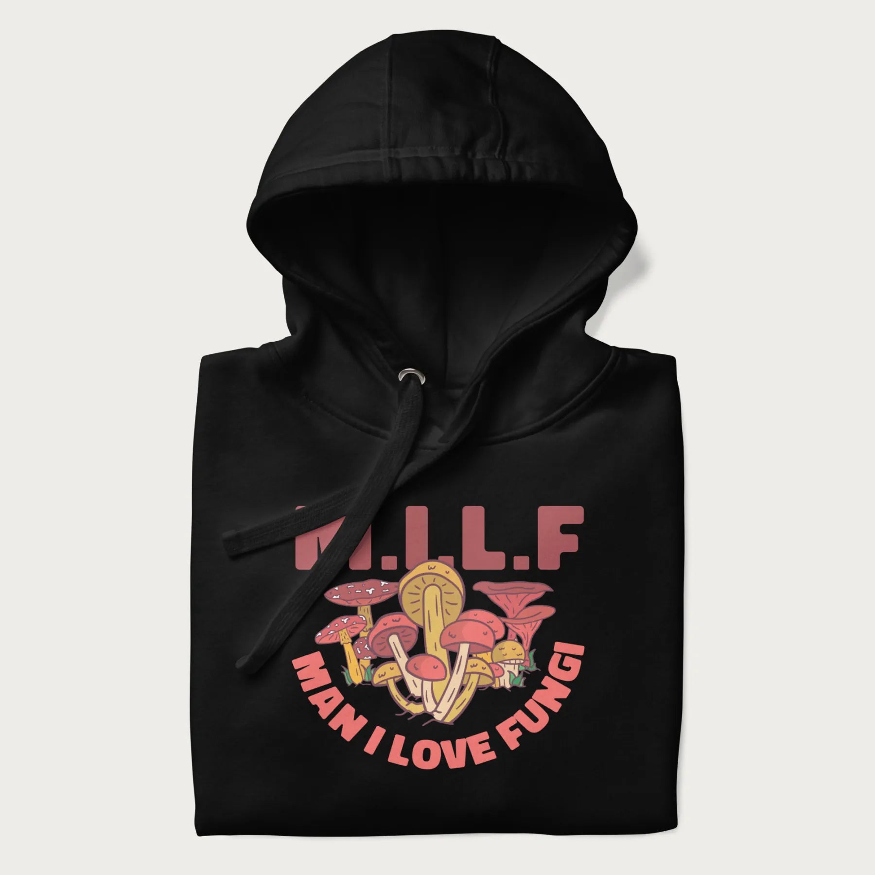 Folded black hoodie with a graphic of various mushrooms and the text 'M.I.L.F - Man I Love Fungi'.