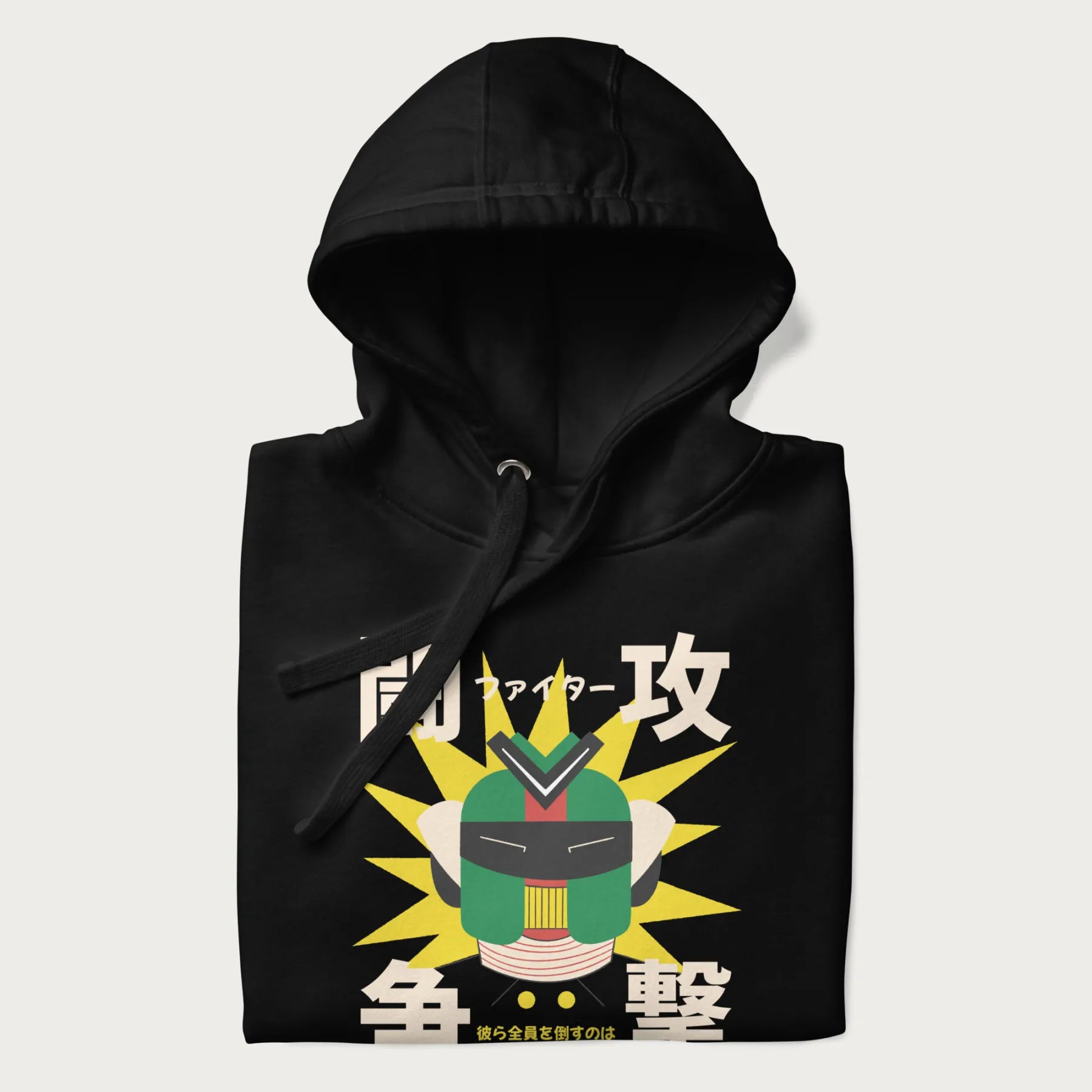 Folded black hoodie with retro graphic of a mecha warrior and Japanese text for "Fight," "Attack," "Conflict," and "Destiny to defeat them all".