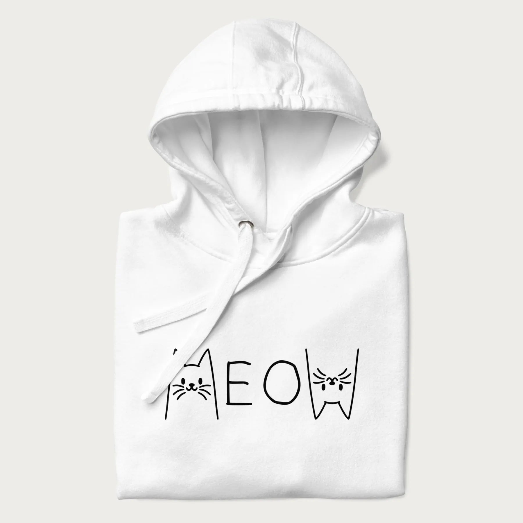 Folded white meow hoodie with a simple 'MEOW' text and cute cat face graphics on the front.