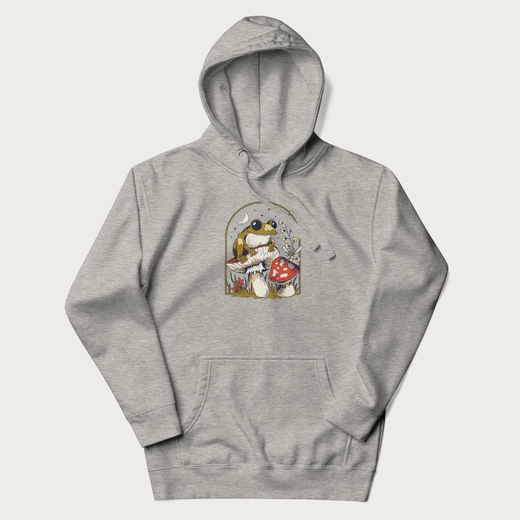 Light grey hoodie with cottagecore graphic of a frog perched on a mushroom, surrounded by additional mushrooms, flowers, and a crescent moon with stars.