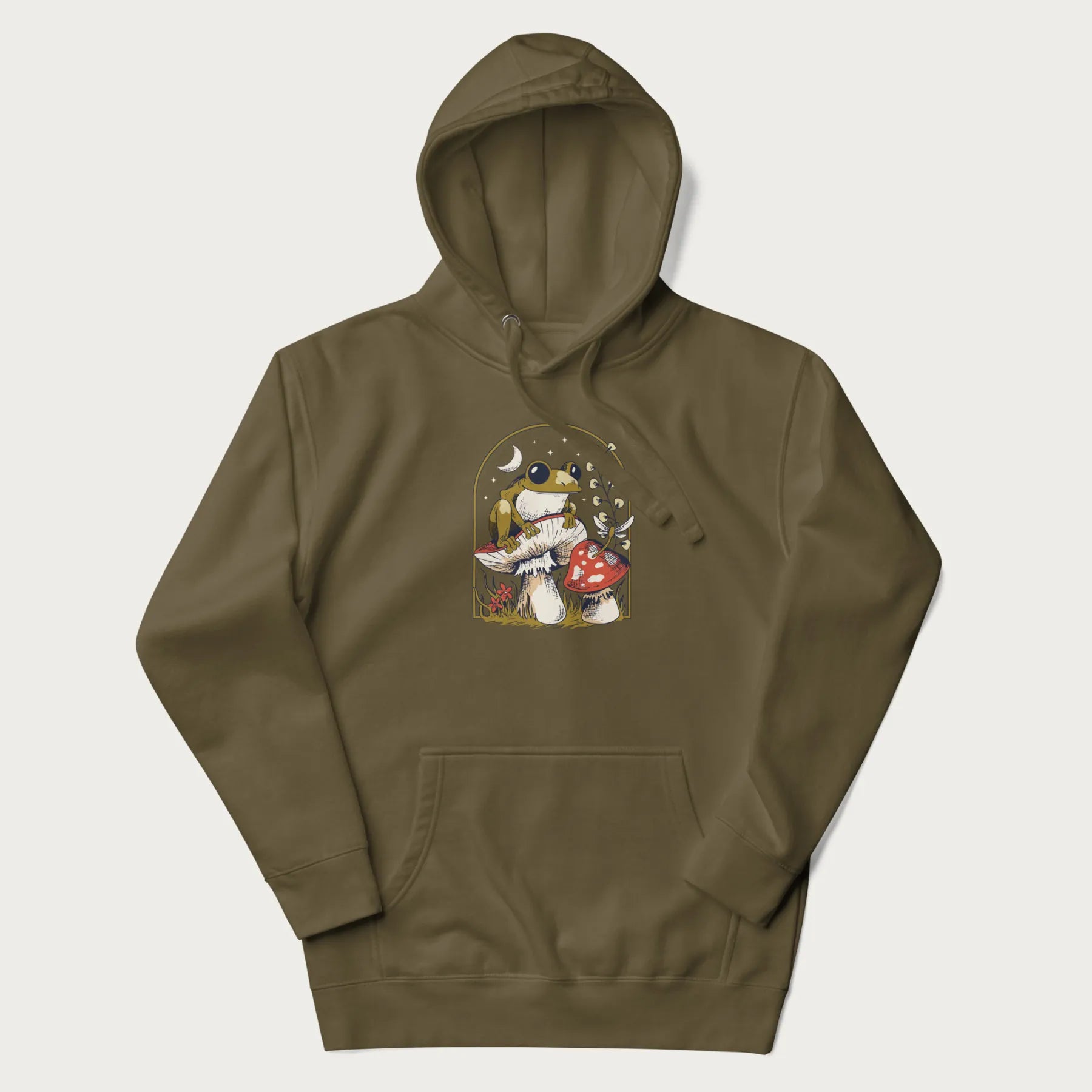 Military green hoodie with cottagecore graphic of a frog perched on a mushroom, surrounded by additional mushrooms, flowers, and a crescent moon with stars.