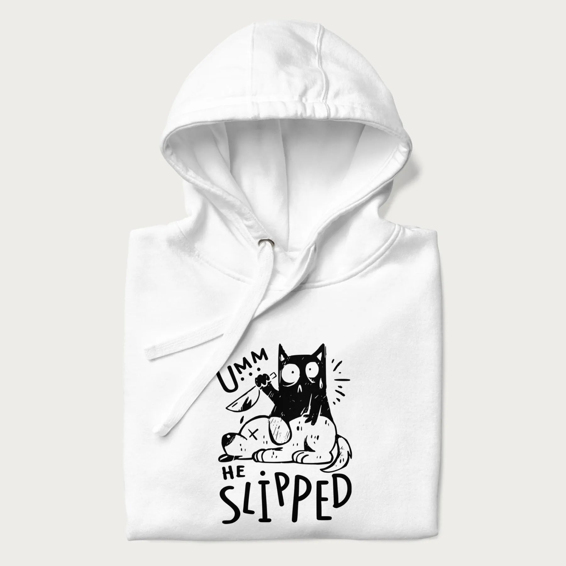 Folded white hoodie with a graphic of a black cat holding a knife over a dog with a funny phrase 'Umm, He Slipped'.