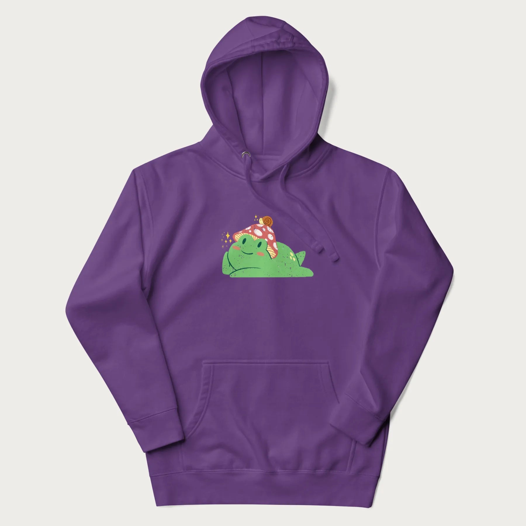 Purple hoodie with a cottagecore design of a green frog wearing a mushroom cap and a snail on top.