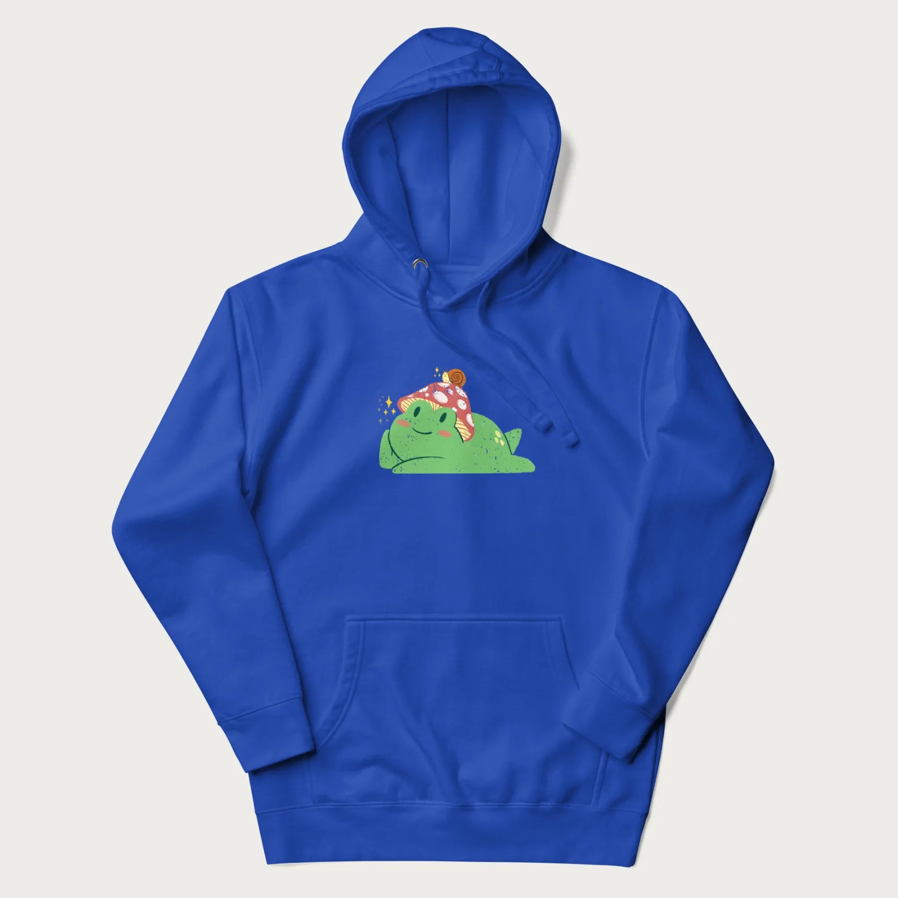 Royal blue hoodie with a cottagecore design of a green frog wearing a mushroom cap and a snail on top.