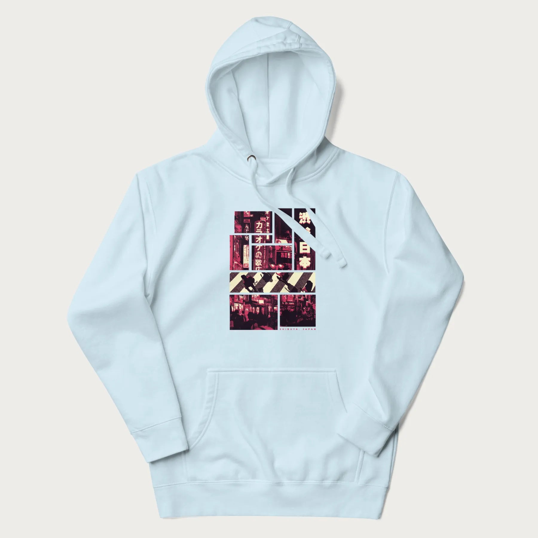 Light blue hoodie with Japanese graphic panels of Shibuya Crossing, Japanese text, and neon signs.