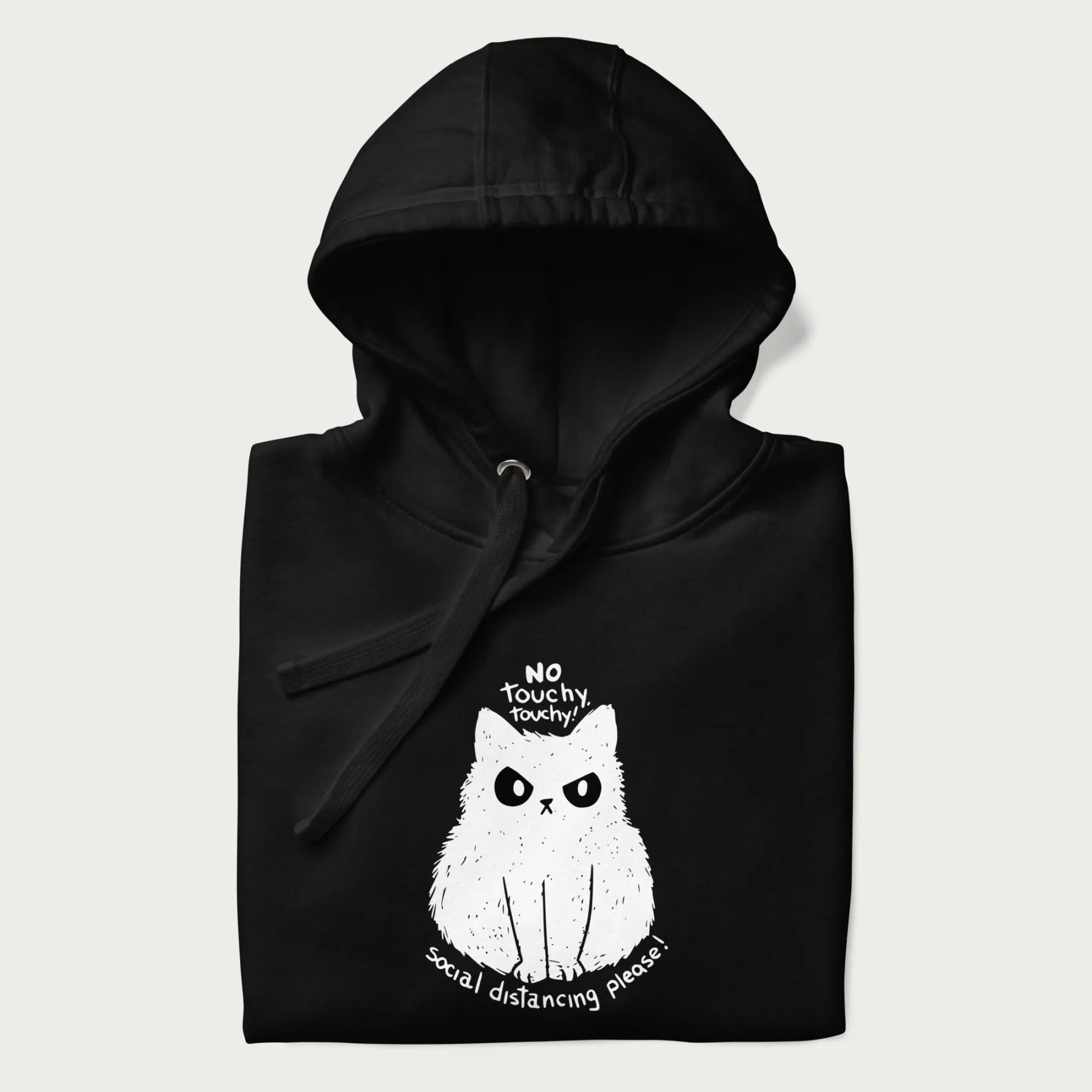 Folded black hoodie with a 'No Touchy, Touchy! Social Distancing Please!' white cat graphic design.