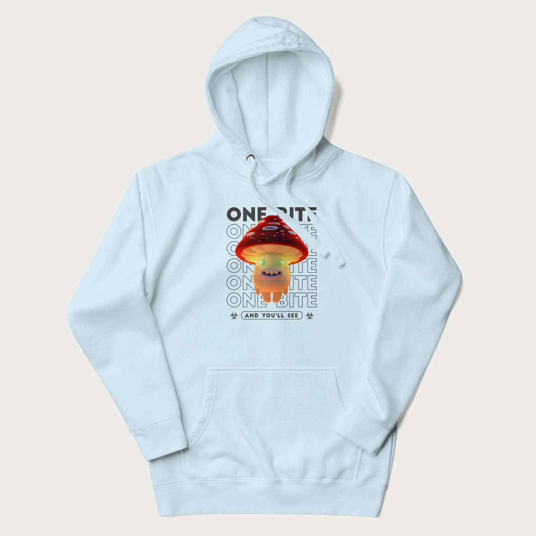 Light blue hoodie with a graphic of a glowing, cartoon realistic mushroom character and the text 'One Bite And You'll See'.
