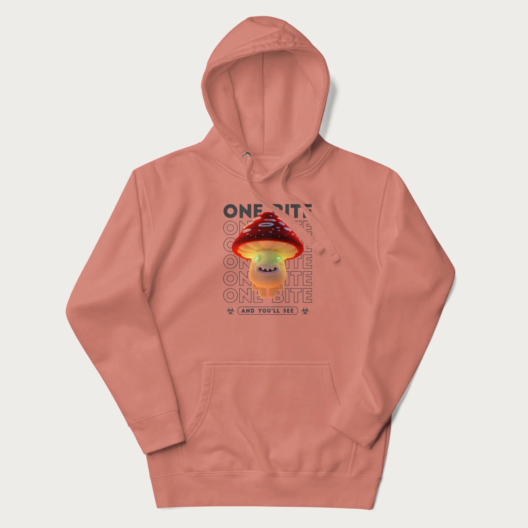 Light pink hoodie with a graphic of a glowing, cartoon realistic mushroom character and the text 'One Bite And You'll See'.