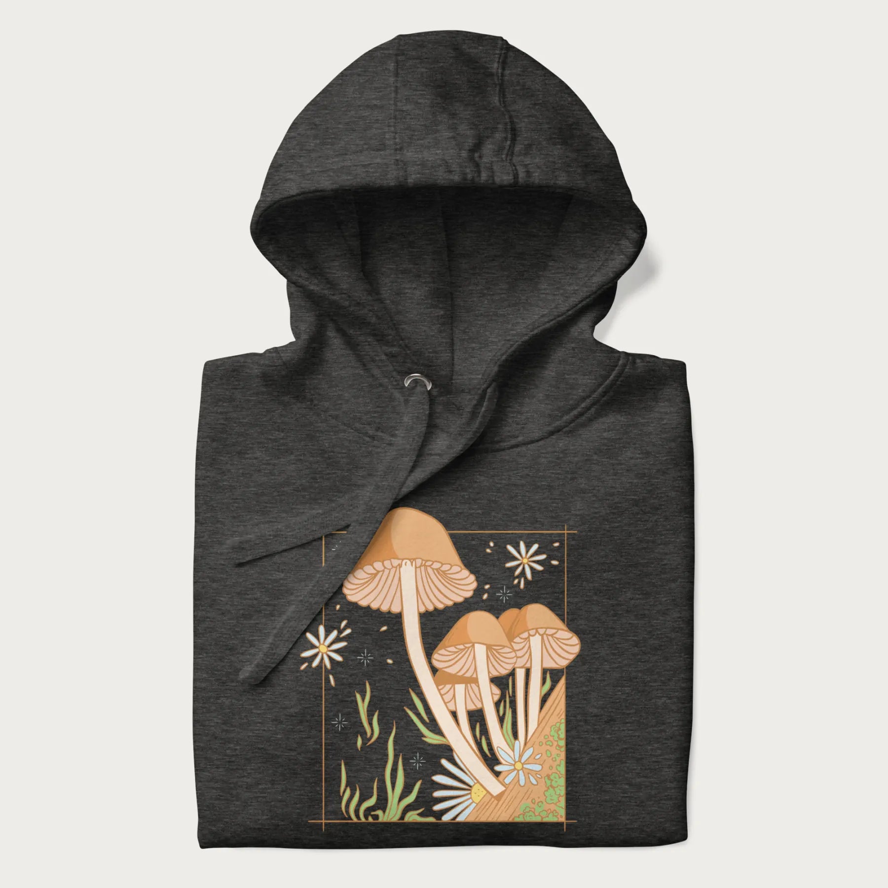Folded dark grey hoodie with a detailed cottagecore illustration of Psilocybe mushrooms and flowers.