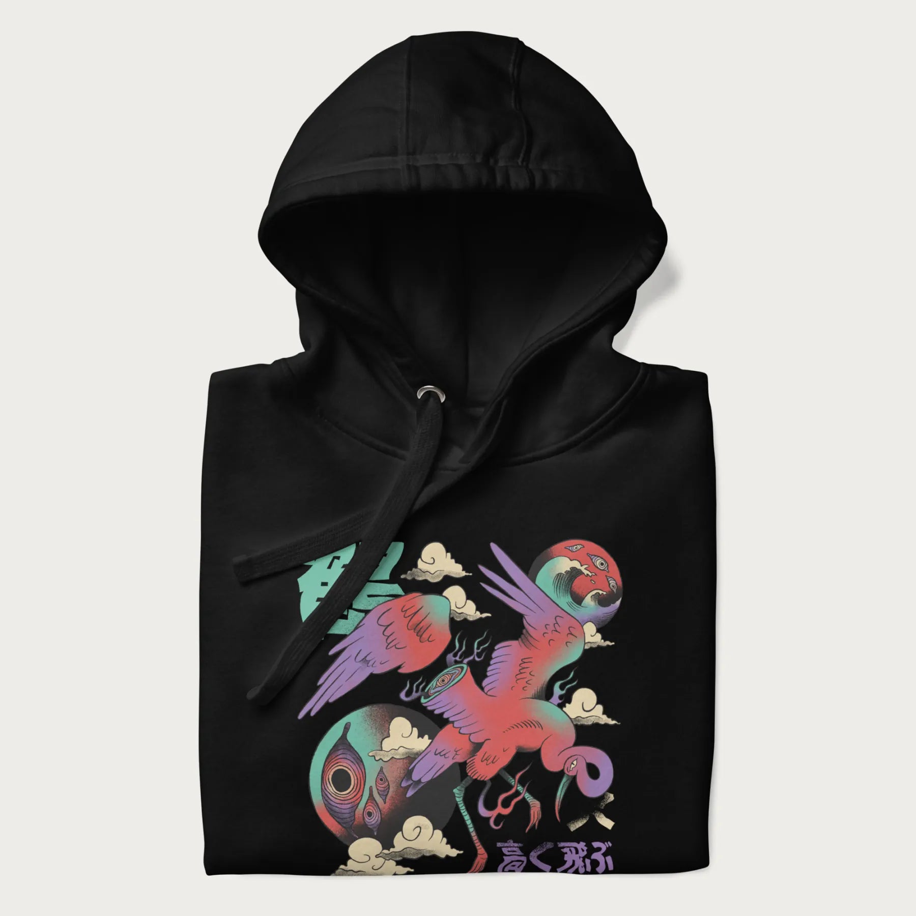 Folded black hoodie with Japanese crane graphic in vibrant colors and Japanese text '鶴' (Crane) and '高く飛ぶ' (Fly High).