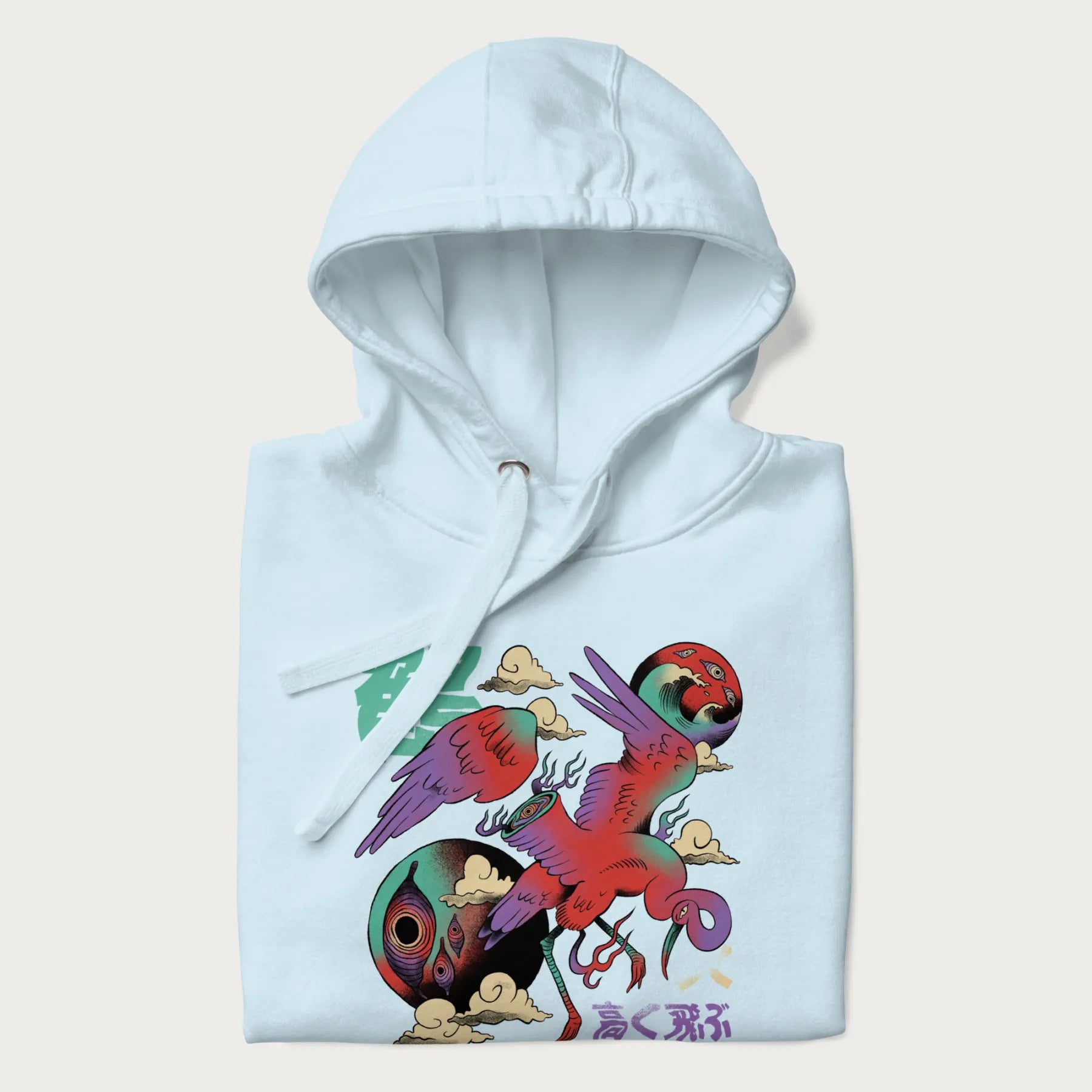 Folded light blue hoodie with Japanese crane graphic in vibrant colors and Japanese text '鶴' (Crane) and '高く飛ぶ' (Fly High).