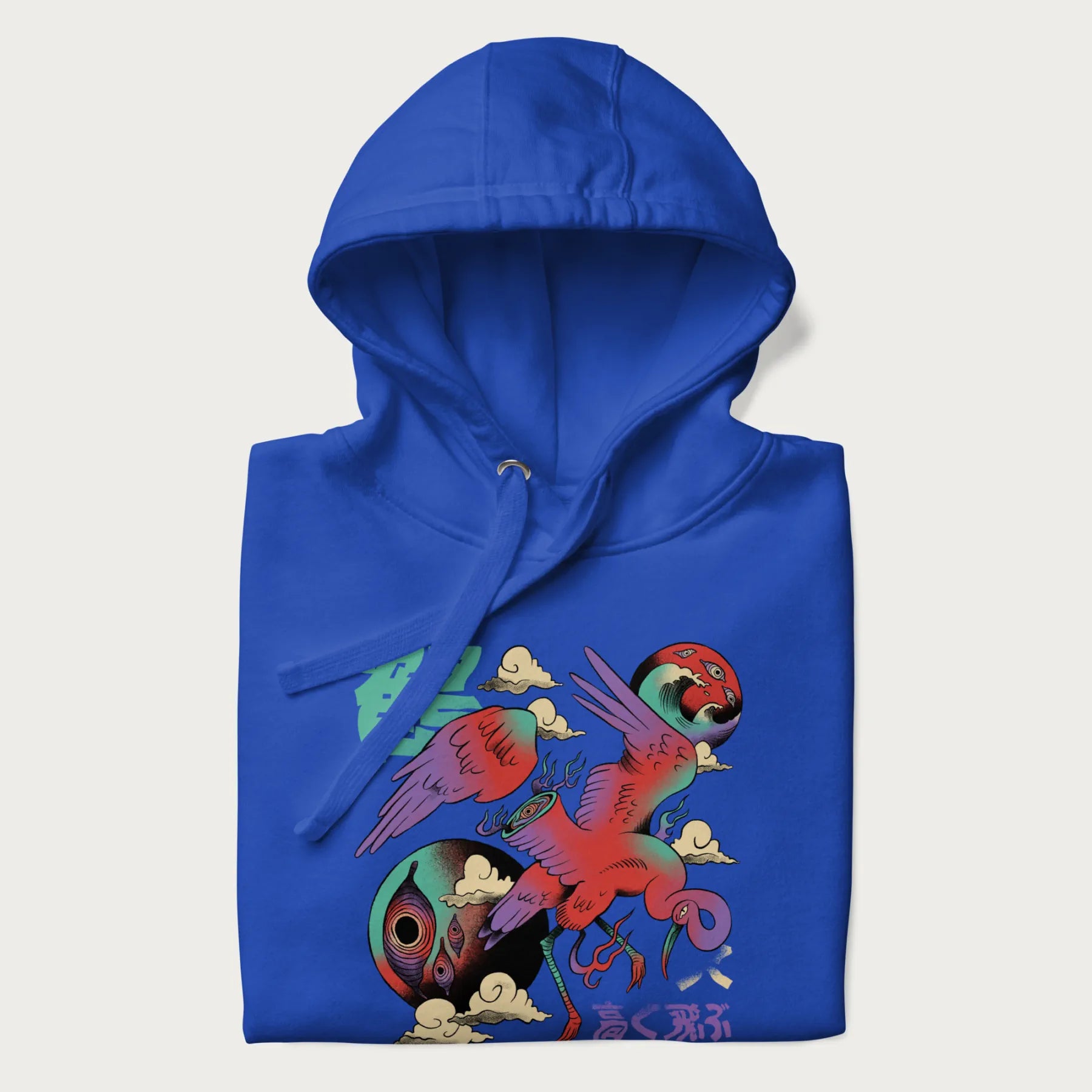 Folded royal blue hoodie with Japanese crane graphic in vibrant colors and Japanese text '鶴' (Crane) and '高く飛ぶ' (Fly High).