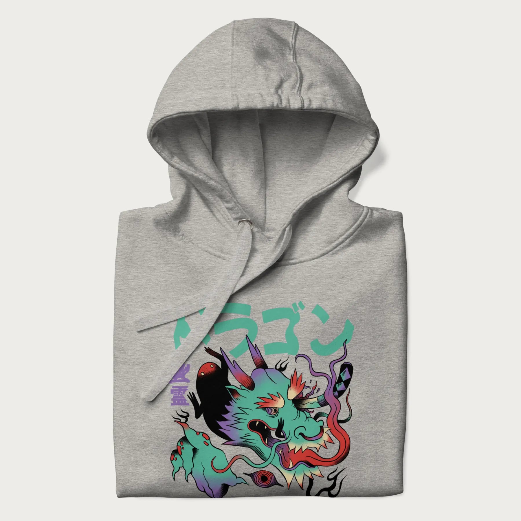 Folded light grey hoodie with Japanese dragon psychedelic graphic and Japanese text 'ドラゴン' (Dragon) and '幽霊' (Ghost) in stylized fonts.