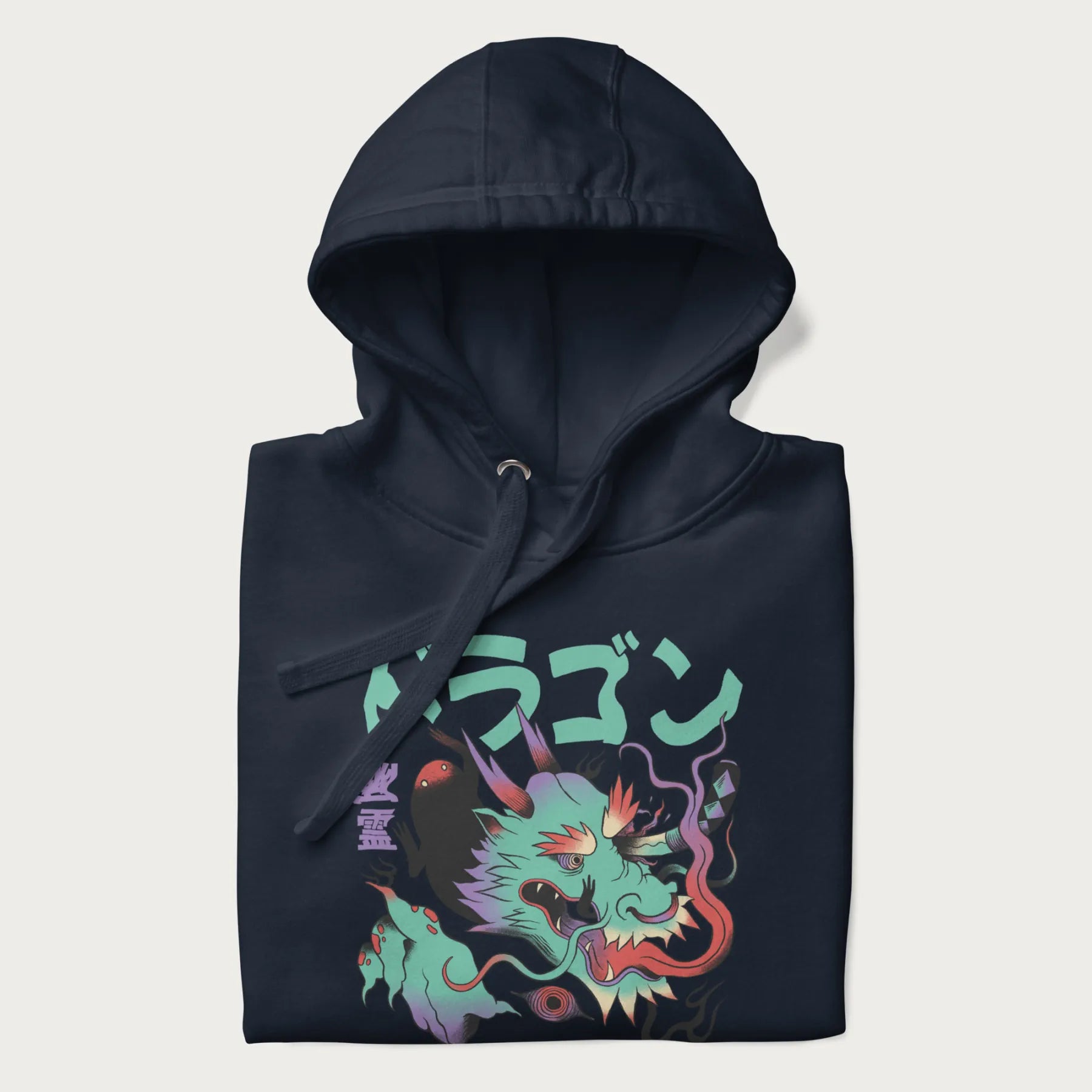Folded navy blue hoodie with Japanese dragon psychedelic graphic and Japanese text 'ドラゴン' (Dragon) and '幽霊' (Ghost) in stylized fonts.
