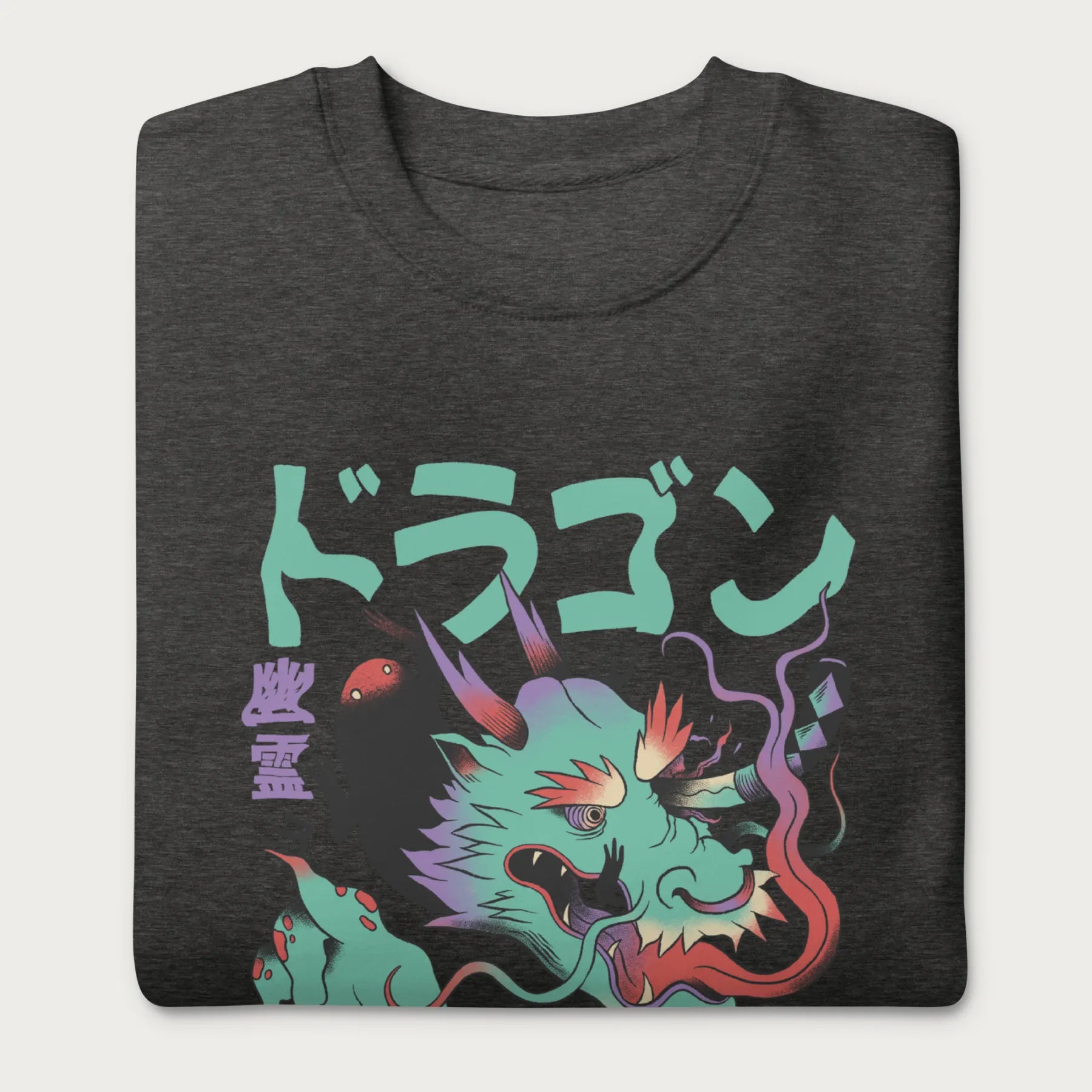 Folded dark grey sweatshirt with a Japanese dragon graphic featuring vibrant colors and Japanese text.