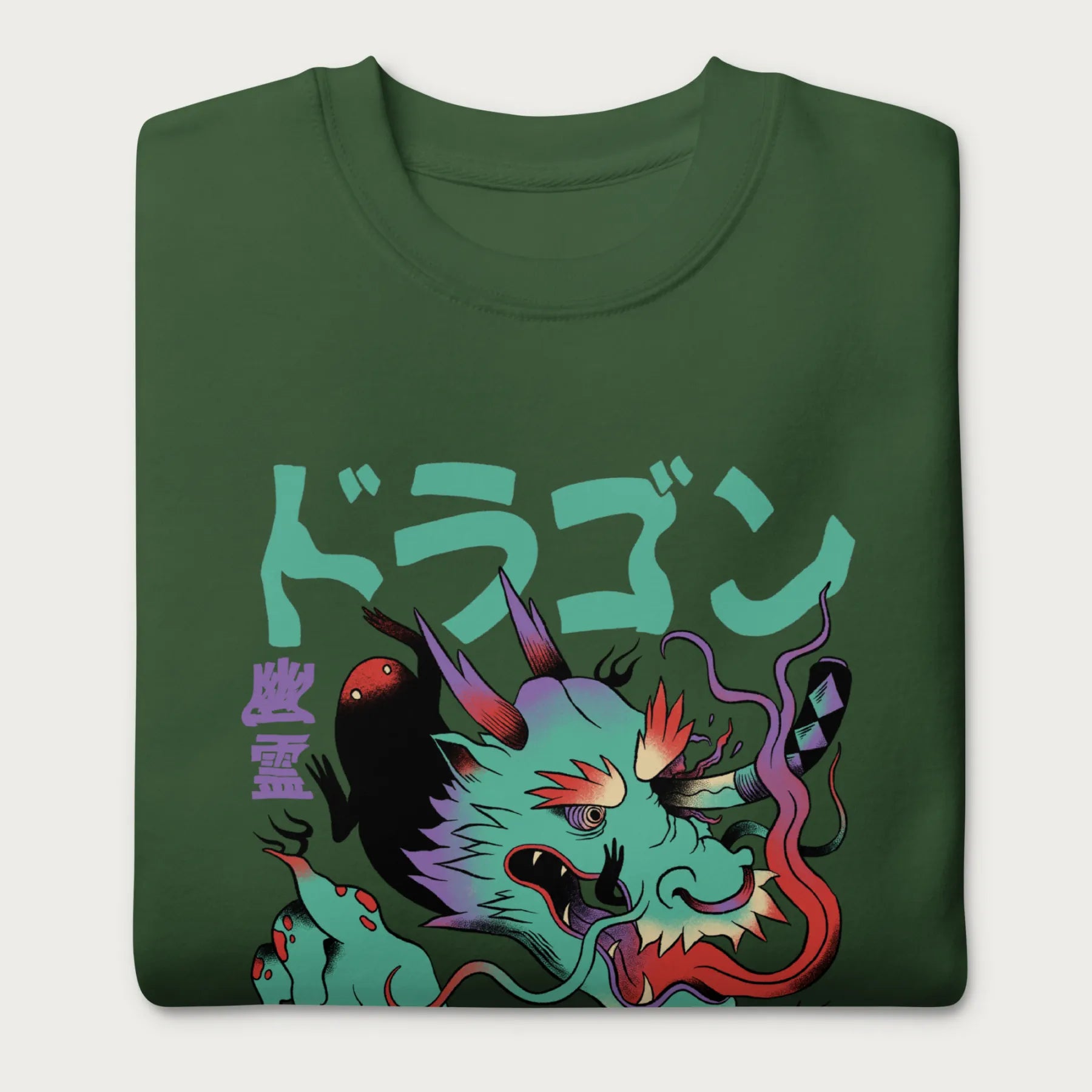 Folded forest green sweatshirt with a Japanese dragon graphic featuring vibrant colors and Japanese text.