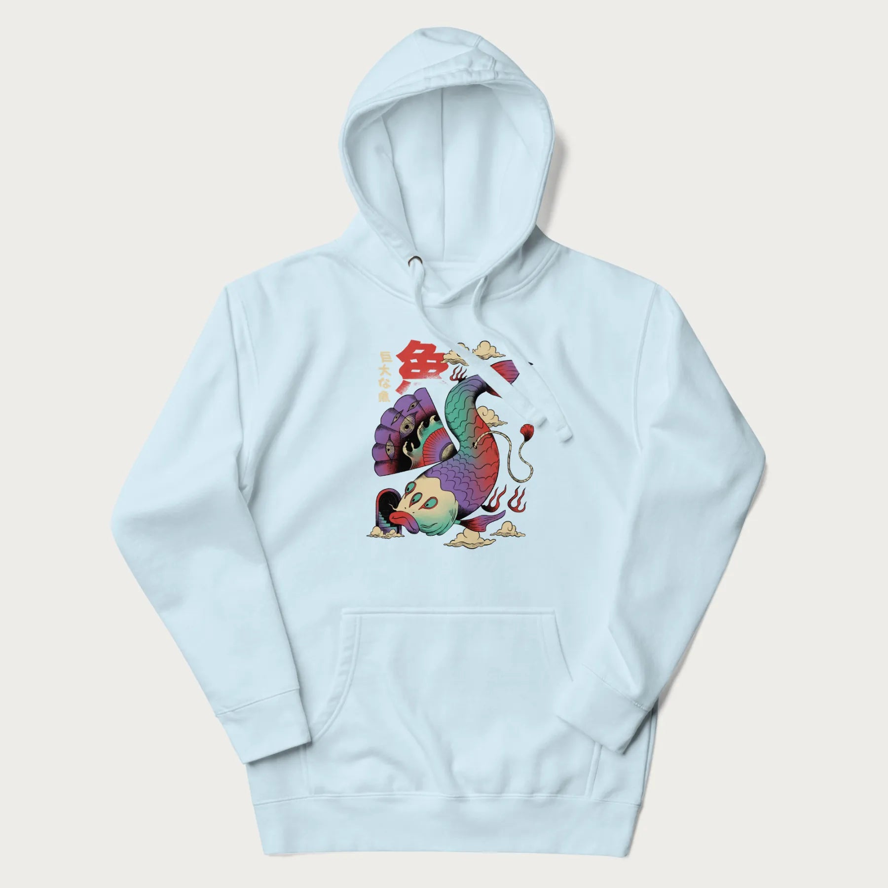 Light blue hoodie with Japanese graphic of a colorful psychedelic koi fish, with Japanese text '魚' (Fish) and '巨大な魚' (Giant Fish).
