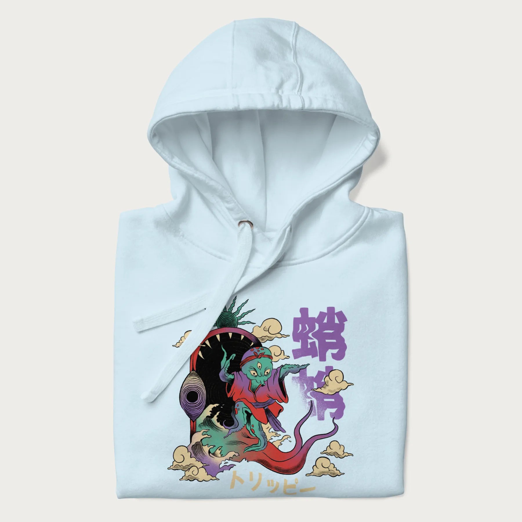 Folded light blue hoodie with Japanese graphic of a colorful psychedelic octopus, with Japanese text '蛸' (Octopus) and 'トリッピー' (Trippy).