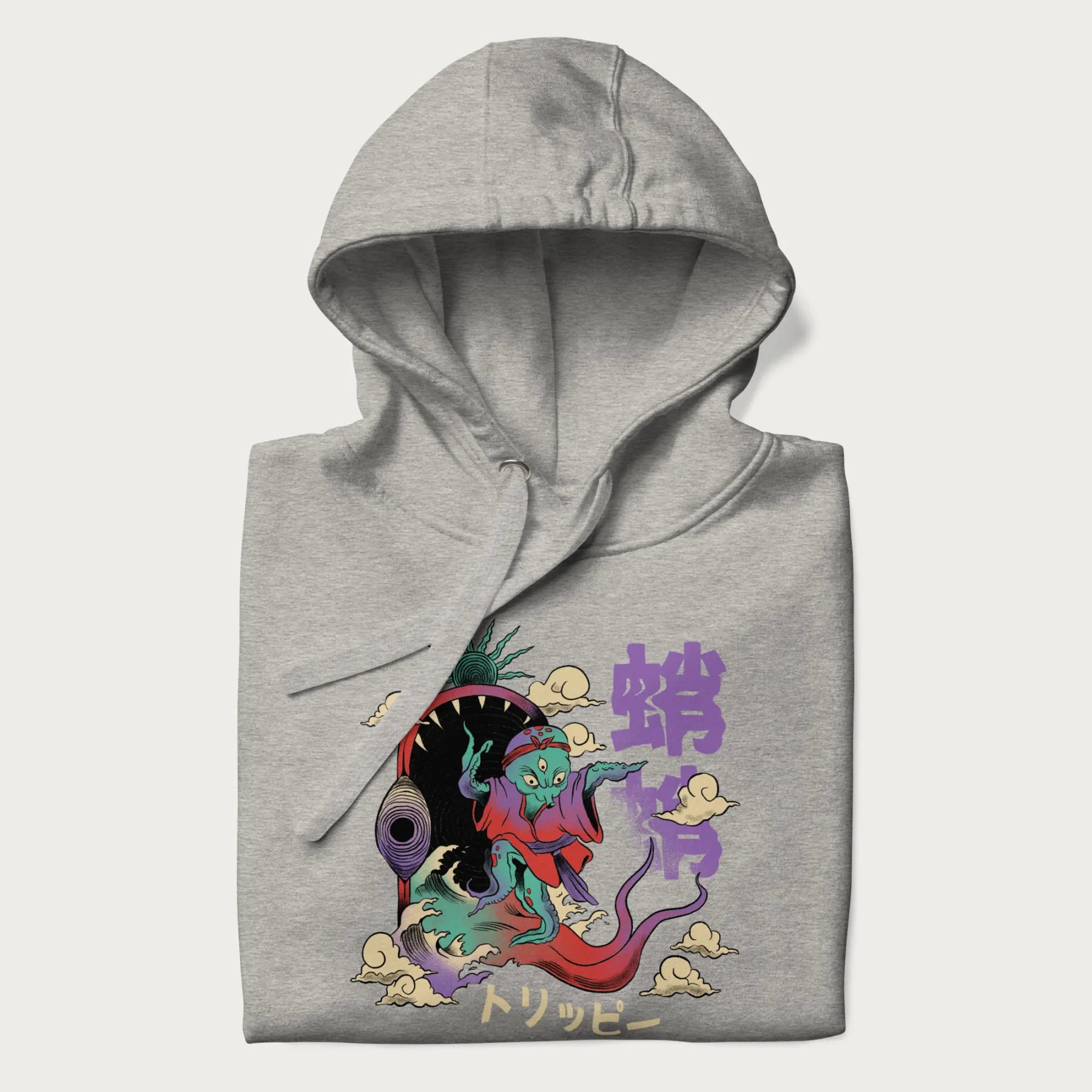 Folded light grey hoodie with Japanese graphic of a colorful psychedelic octopus, with Japanese text '蛸' (Octopus) and 'トリッピー' (Trippy).