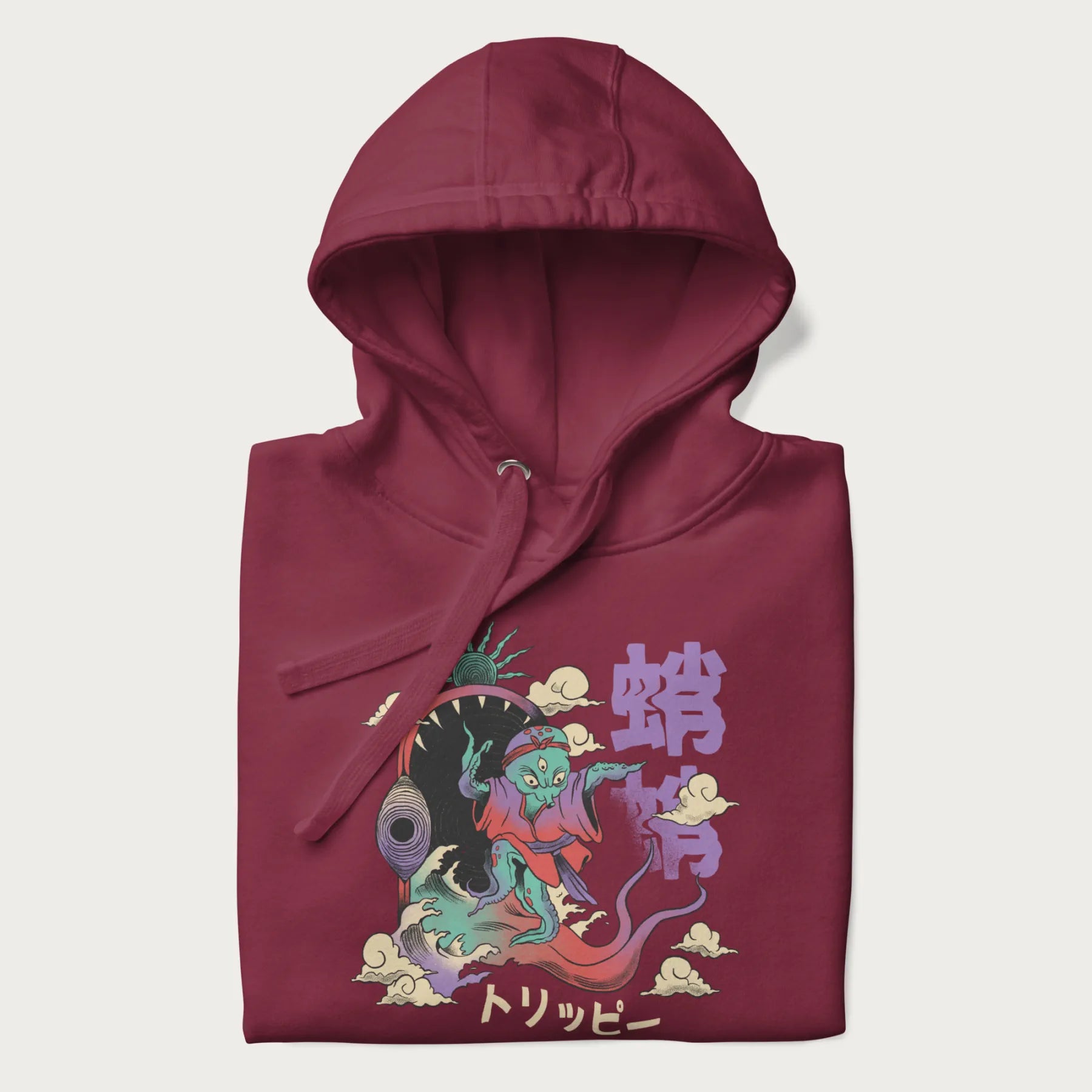 Folded maroon hoodie with Japanese graphic of a colorful psychedelic octopus, with Japanese text '蛸' (Octopus) and 'トリッピー' (Trippy).