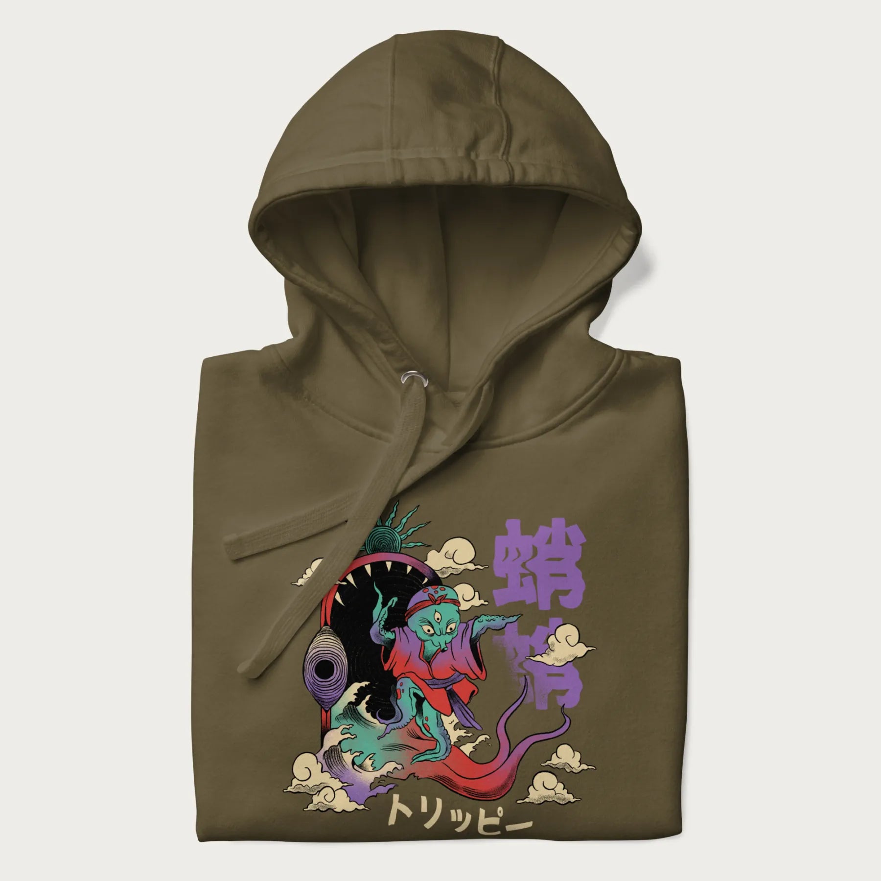 Folded military green hoodie with Japanese graphic of a colorful psychedelic octopus, with Japanese text '蛸' (Octopus) and 'トリッピー' (Trippy).