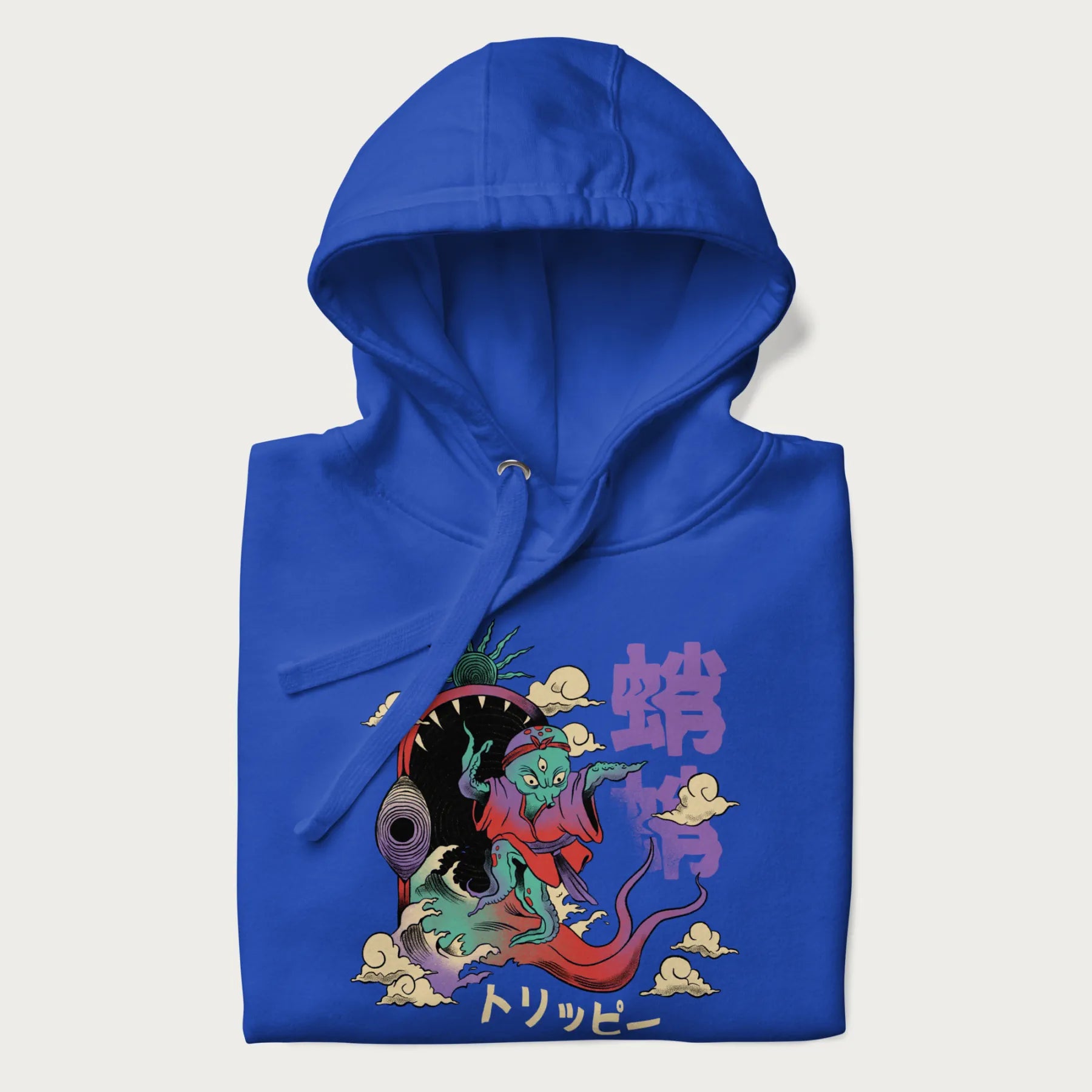 Folded royal blue hoodie with Japanese graphic of a colorful psychedelic octopus, with Japanese text '蛸' (Octopus) and 'トリッピー' (Trippy).