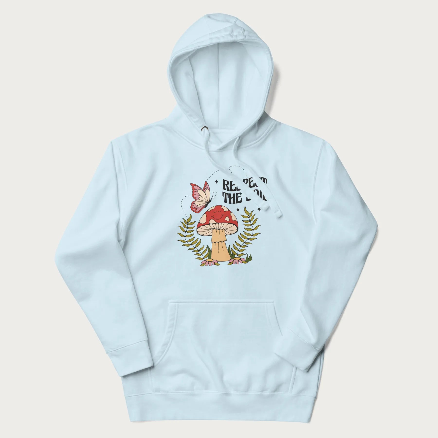 Light blue hoodie with mushroom and butterfly design, with the text 'Respect the Soil' above it.