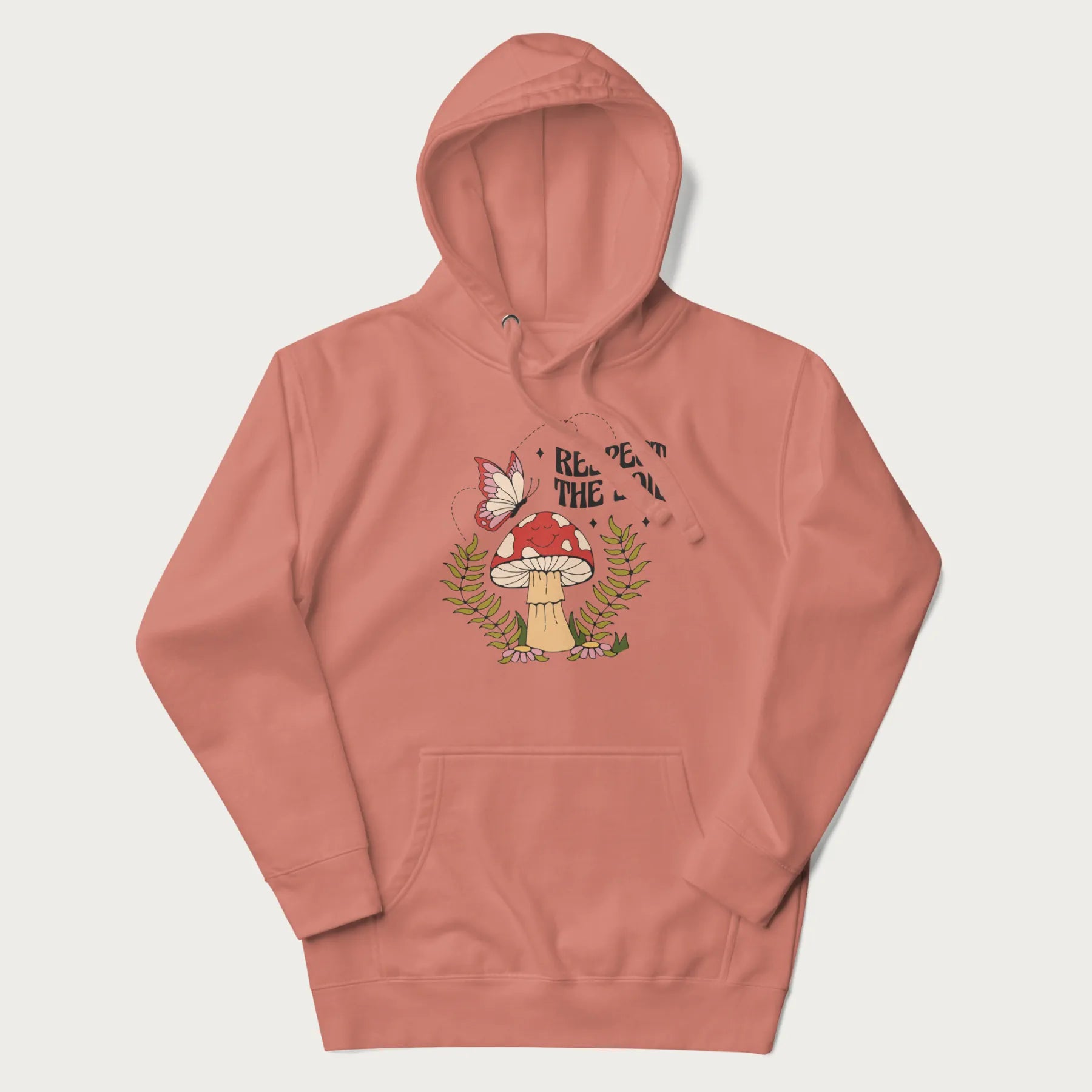 Light pink hoodie with mushroom and butterfly design, with the text 'Respect the Soil' above it.