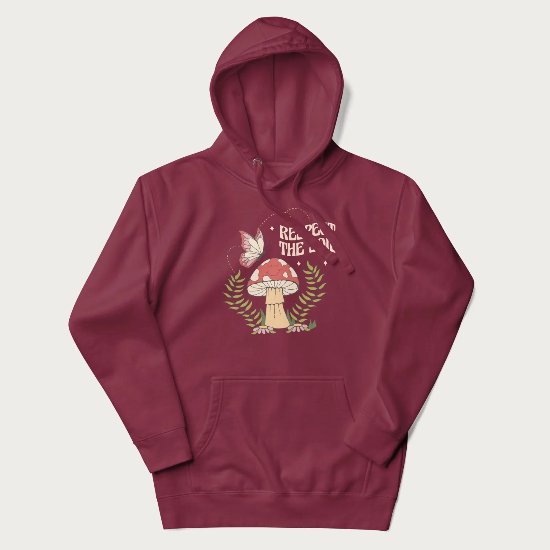 Maroon hoodie with mushroom and butterfly design, with the text 'Respect the Soil' above it.
