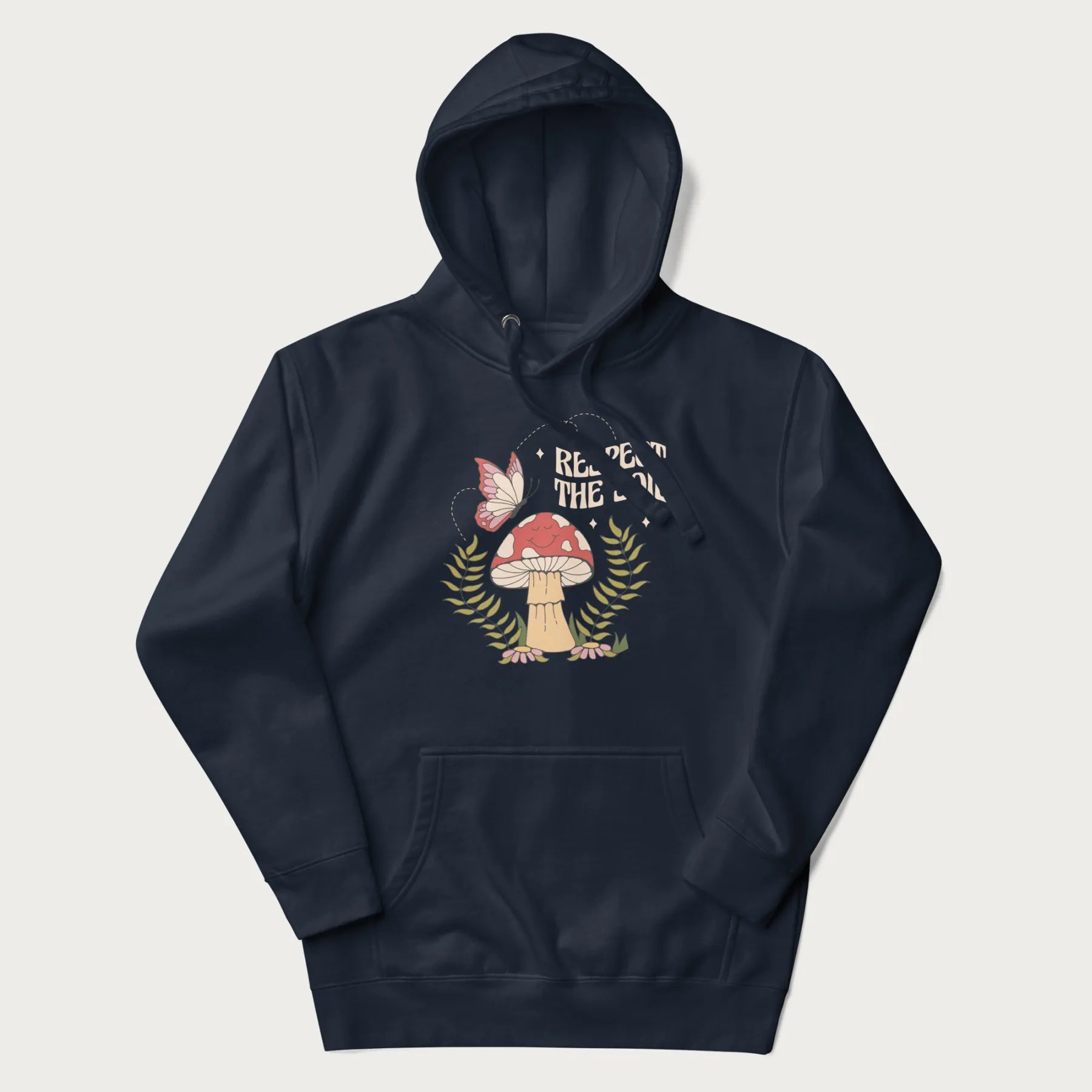 Navy blue hoodie with mushroom and butterfly design, with the text 'Respect the Soil' above it.