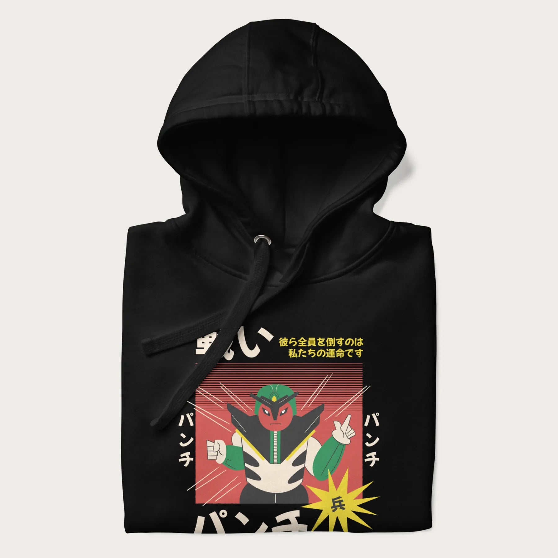 Folded black hoodie with Japanese retro graphic of a samurai-inspired robot and Japanese words for "Fight," "Punch," and "Soldier".